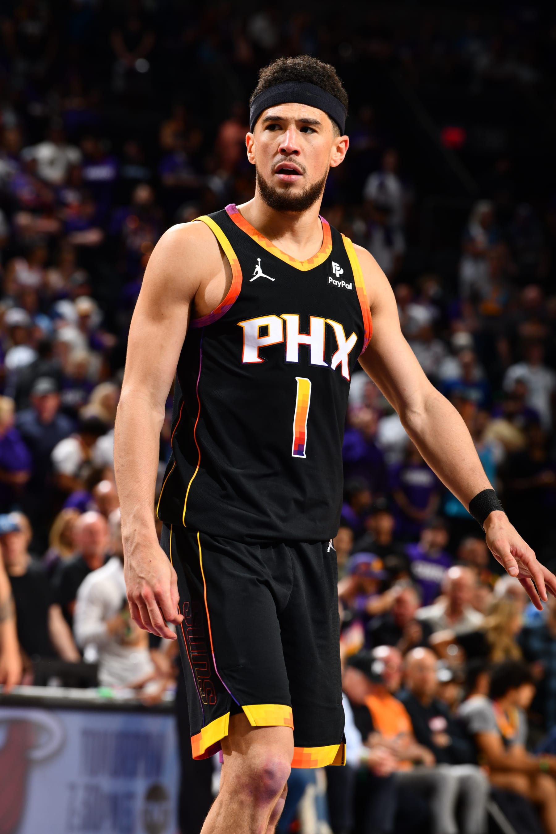 PHOENIX, AZ - APRIL 4: Devin Booker #1 of the Phoenix Suns looks on during the game against the Minnesota Timberwolves during Round 1 Game 4 of the 2024 NBA Playoffs on April 4, 2023 at Footprint Center in Phoenix, Arizona. NOTE TO USER: User expressly acknowledges and agrees that, by downloading and or using this photograph, user is consenting to the terms and conditions of the Getty Images License Agreement. Mandatory Copyright Notice: Copyright 2024 NBAE (Photo by Barry Gossage/NBAE via Getty Images)