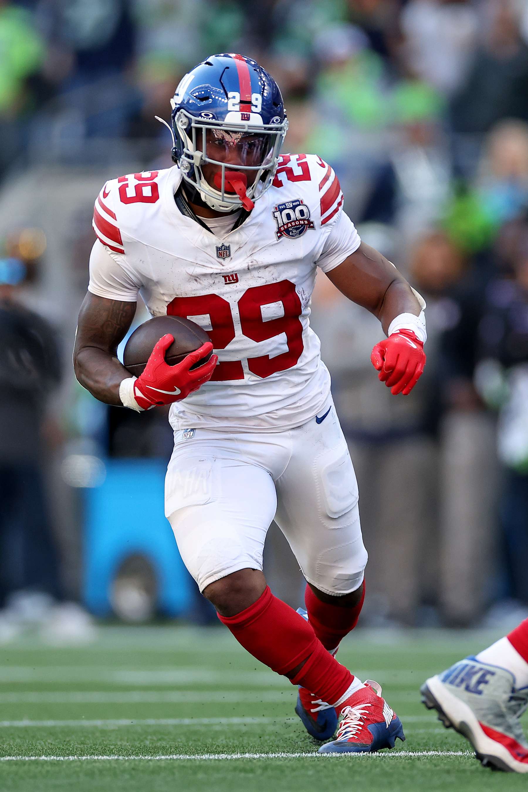 SEATTLE, WASHINGTON - OCTOBER 06: Tyrone Tracy Jr. #29 of the New York Giants carries the ball against the Seattle Seahawks at Lumen Field on October 06, 2024 in Seattle, Washington. (Photo by Steph Chambers/Getty Images)