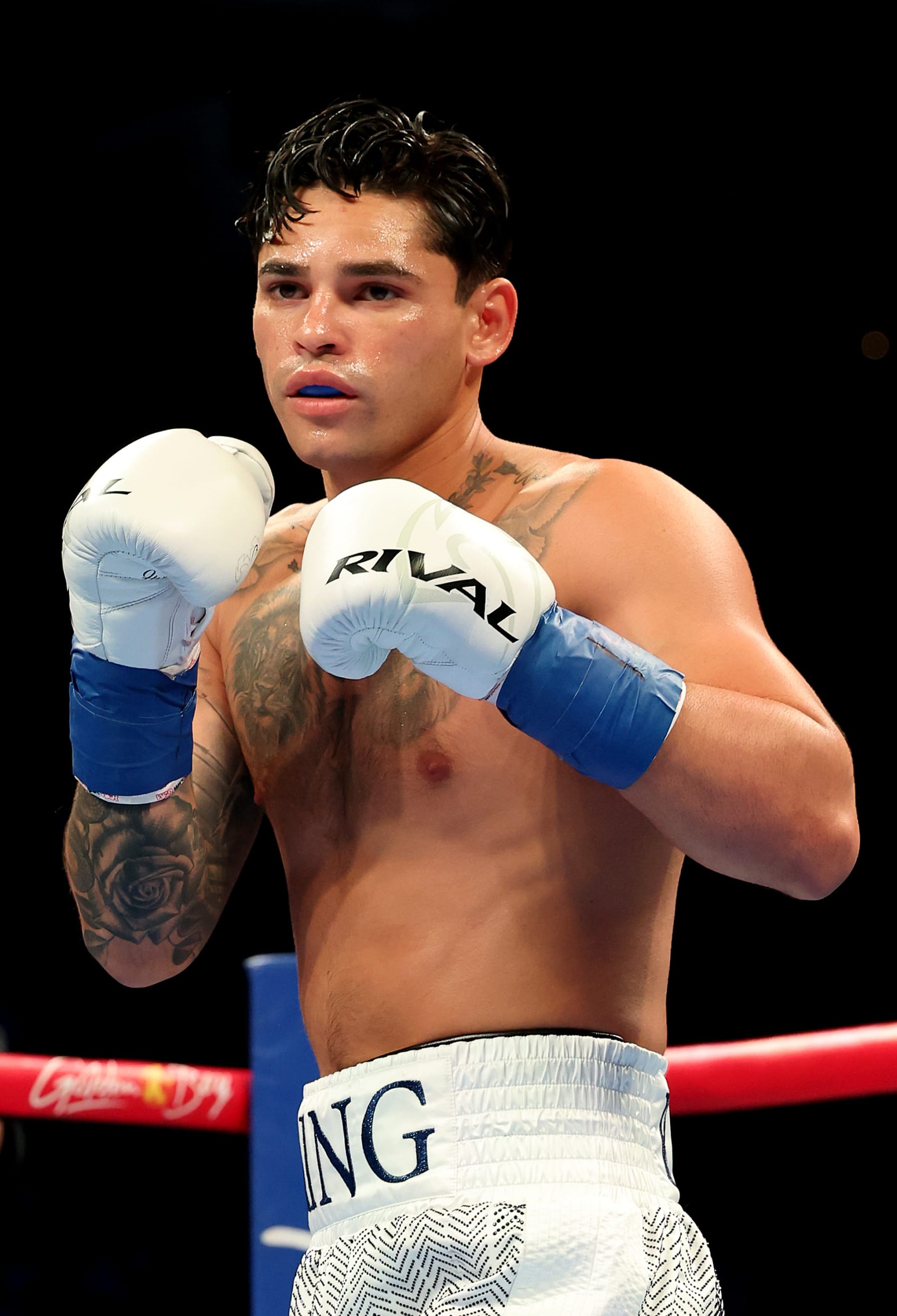 NEW YORK, NEW YORK - APRIL 20: Ryan Garcia (white trunks) prepares to fight Devin Haney during their WBC Super Lightweight title bout at Barclays Center on April 20, 2024 in New York City.  (Photo by Al Bello/Getty Images)
