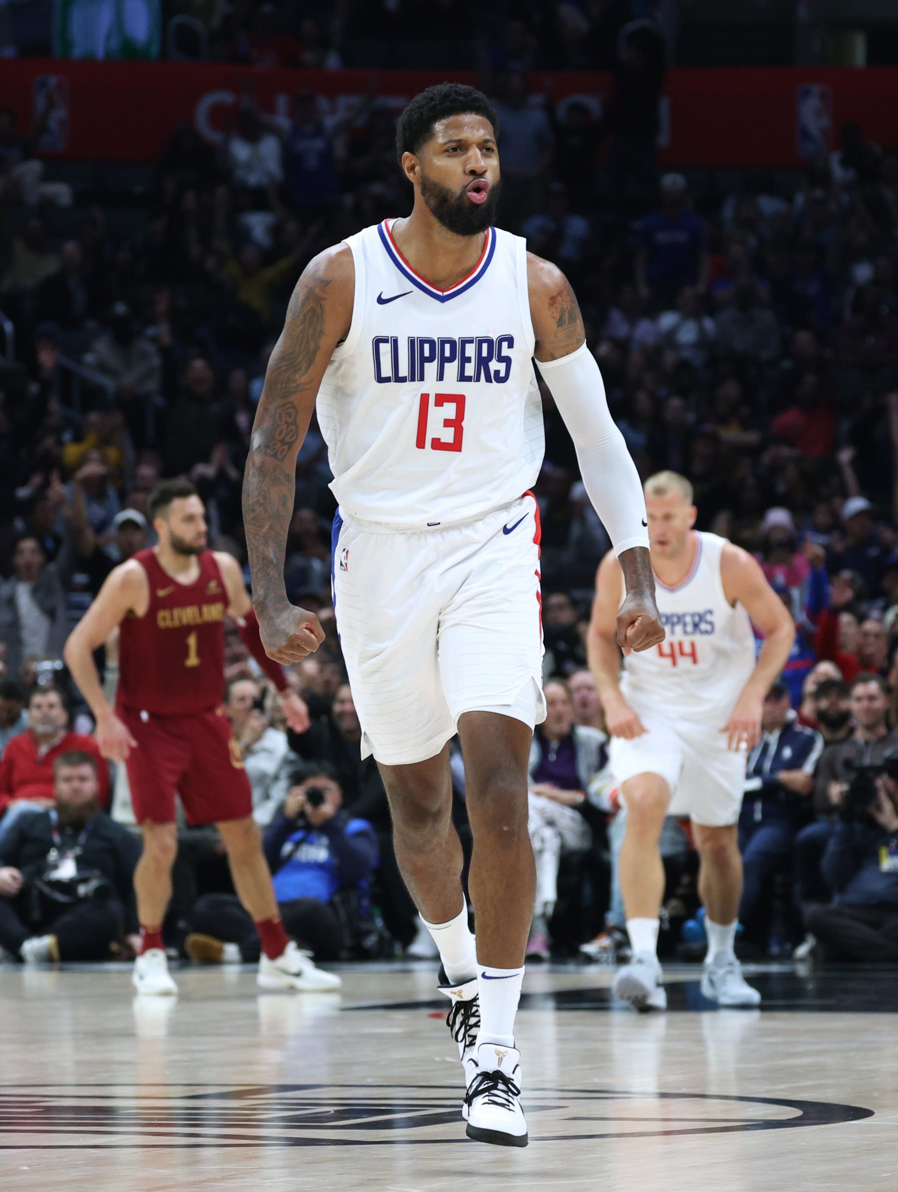 LOS ANGELES, CALIFORNIA - APRIL 07: Paul George #13 of the LA Clippers celebrates his three pointer during a 120-118 Clippers win over the Cleveland Cavaliers at Crypto.com Arena on April 07, 2024 in Los Angeles, California. User is consenting to the terms and conditions of the Getty Images License Agreement. (Photo by Harry How/Getty Images)