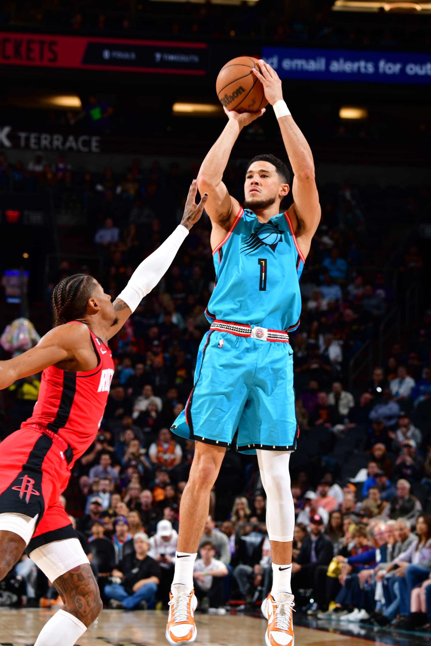 PHOENIX, AZ - DECEMBER 2: Devin Booker #1 of the Phoenix Suns shoots the ball during the game against the Houston Rockets on December 2, 2022 at Footprint Center in Phoenix, Arizona. NOTE TO USER: User expressly acknowledges and agrees that, by downloading and or using this photograph, user is consenting to the terms and conditions of the Getty Images License Agreement. Mandatory Copyright Notice: Copyright 2022 NBAE (Photo by Barry Gossage/NBAE via Getty Images)