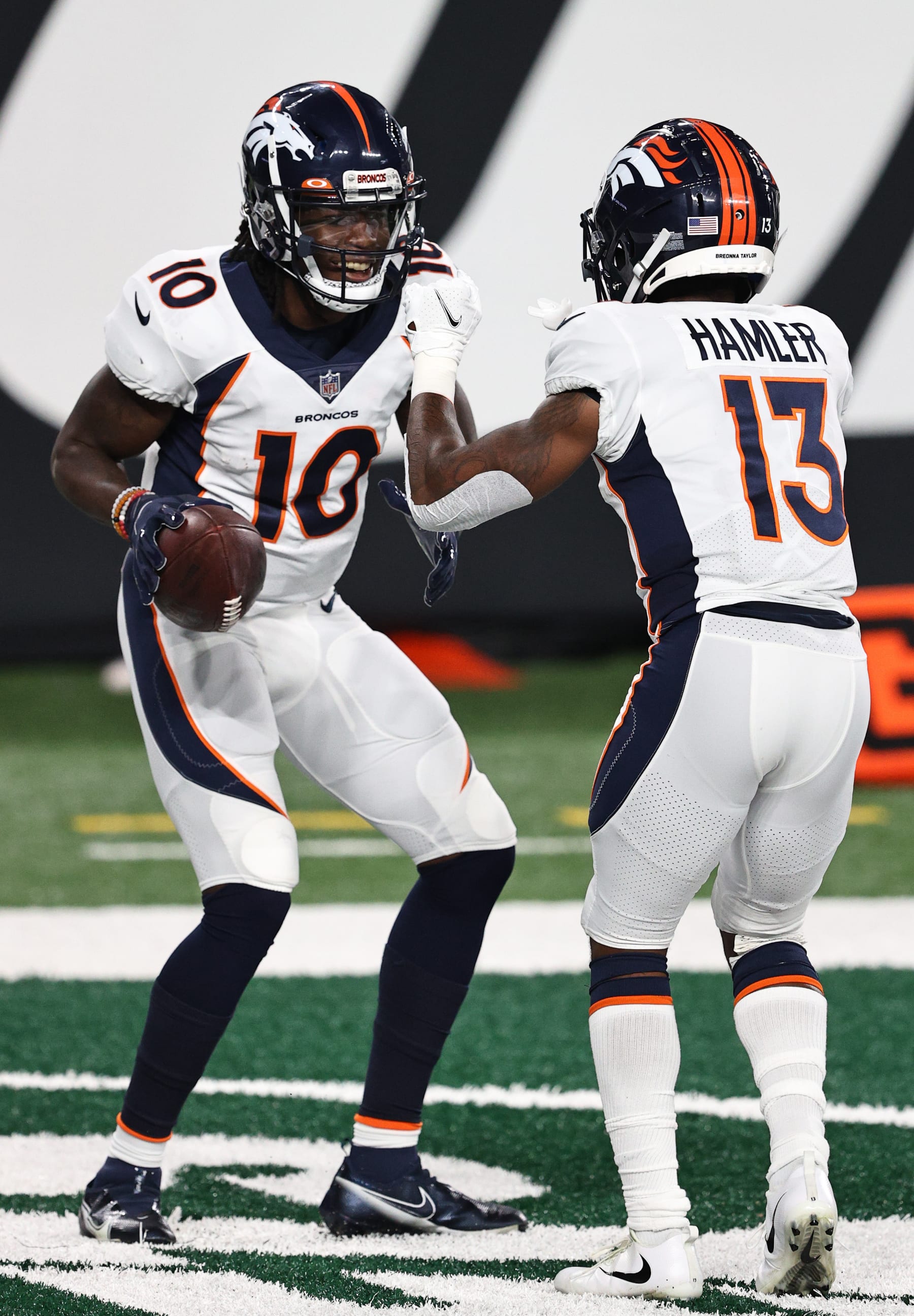 EAST RUTHERFORD, NEW JERSEY - OCTOBER 01: Jerry Jeudy #10 of the Denver Broncos celebrates a touchdown against the New York Jets with teammate K.J. Hamler #13 during the second quarter at MetLife Stadium on October 01, 2020 in East Rutherford, New Jersey. (Photo by Elsa/Getty Images)