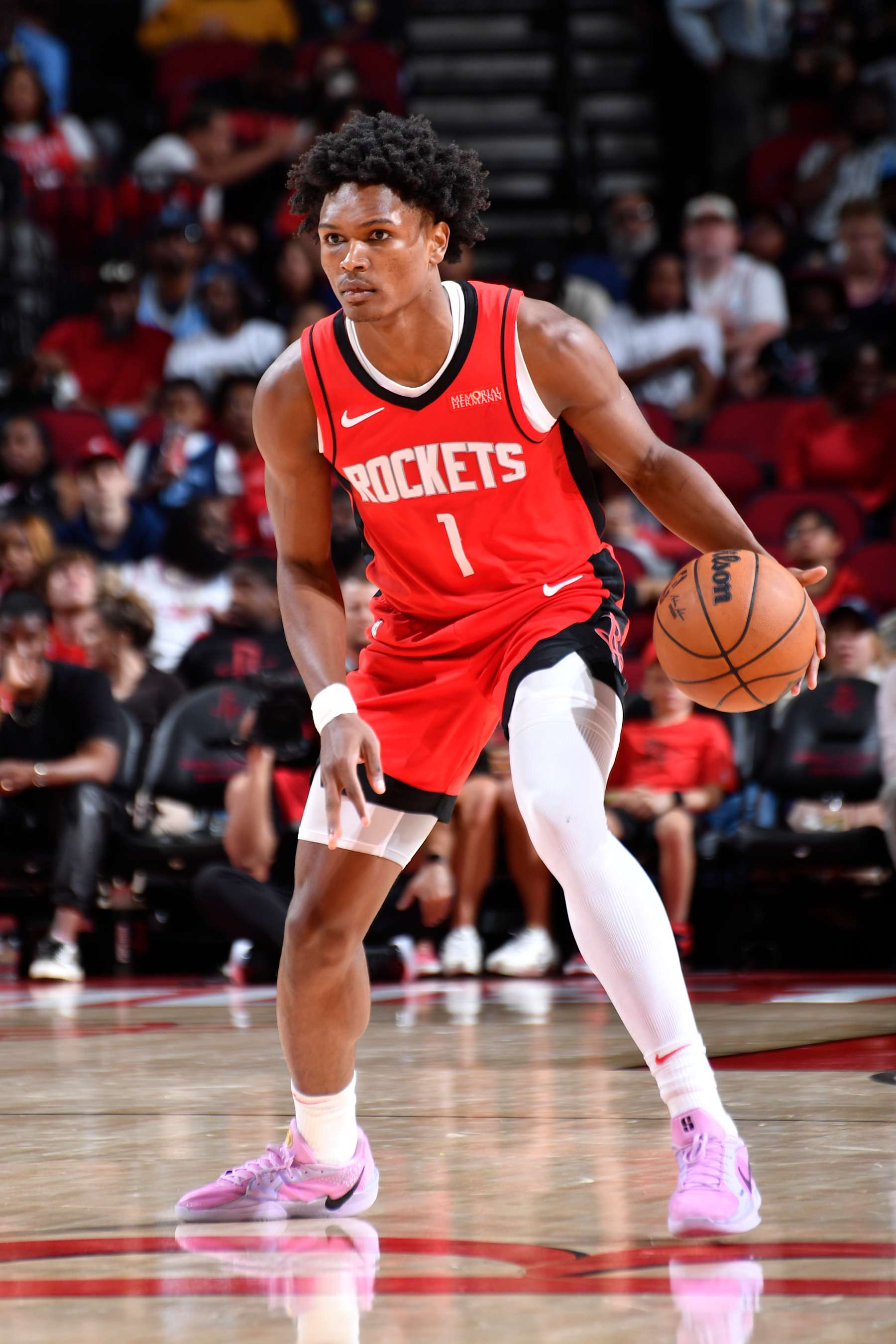 HOUSTON, TX - OCTOBER 25: Amen Thompson #1 of the Houston Rockets dribbles the ball during the game against the Memphis Grizzlies on October 25, 2024 at the Toyota Center in Houston, Texas. NOTE TO USER: User expressly acknowledges and agrees that, by downloading and or using this photograph, User is consenting to the terms and conditions of the Getty Images License Agreement. Mandatory Copyright Notice: Copyright 2024 NBAE (Photo by Logan Riely/NBAE via Getty Images)