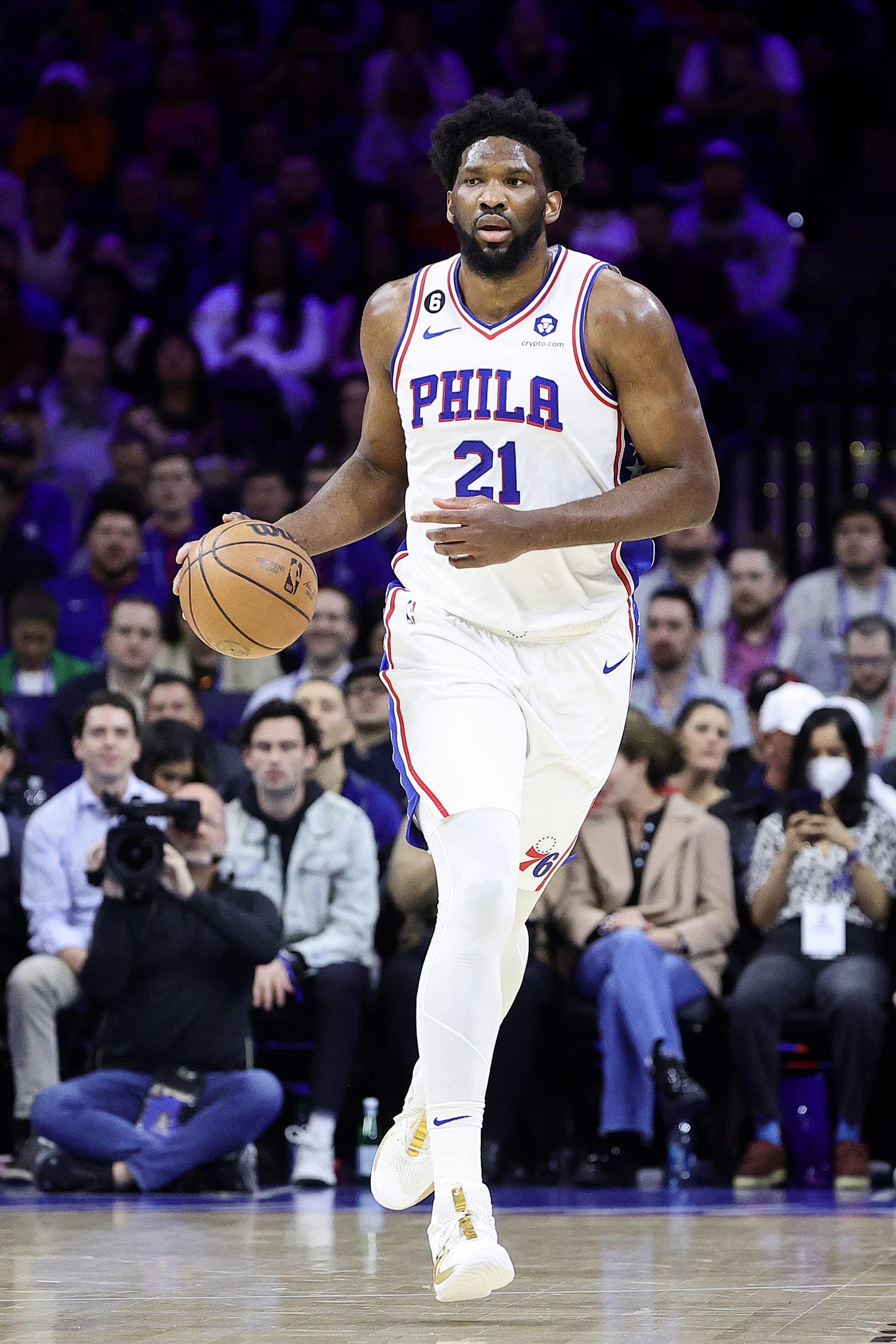 PHILADELPHIA, PENNSYLVANIA - FEBRUARY 15: Joel Embiid #21 of the Philadelphia 76ers dribbles during the first quarter against the Cleveland Cavaliers at Wells Fargo Center on February 15, 2023 in Philadelphia, Pennsylvania. NOTE TO USER: User expressly acknowledges and agrees that, by downloading and or using this photograph, User is consenting to the terms and conditions of the Getty Images License Agreement. (Photo by Tim Nwachukwu/Getty Images)