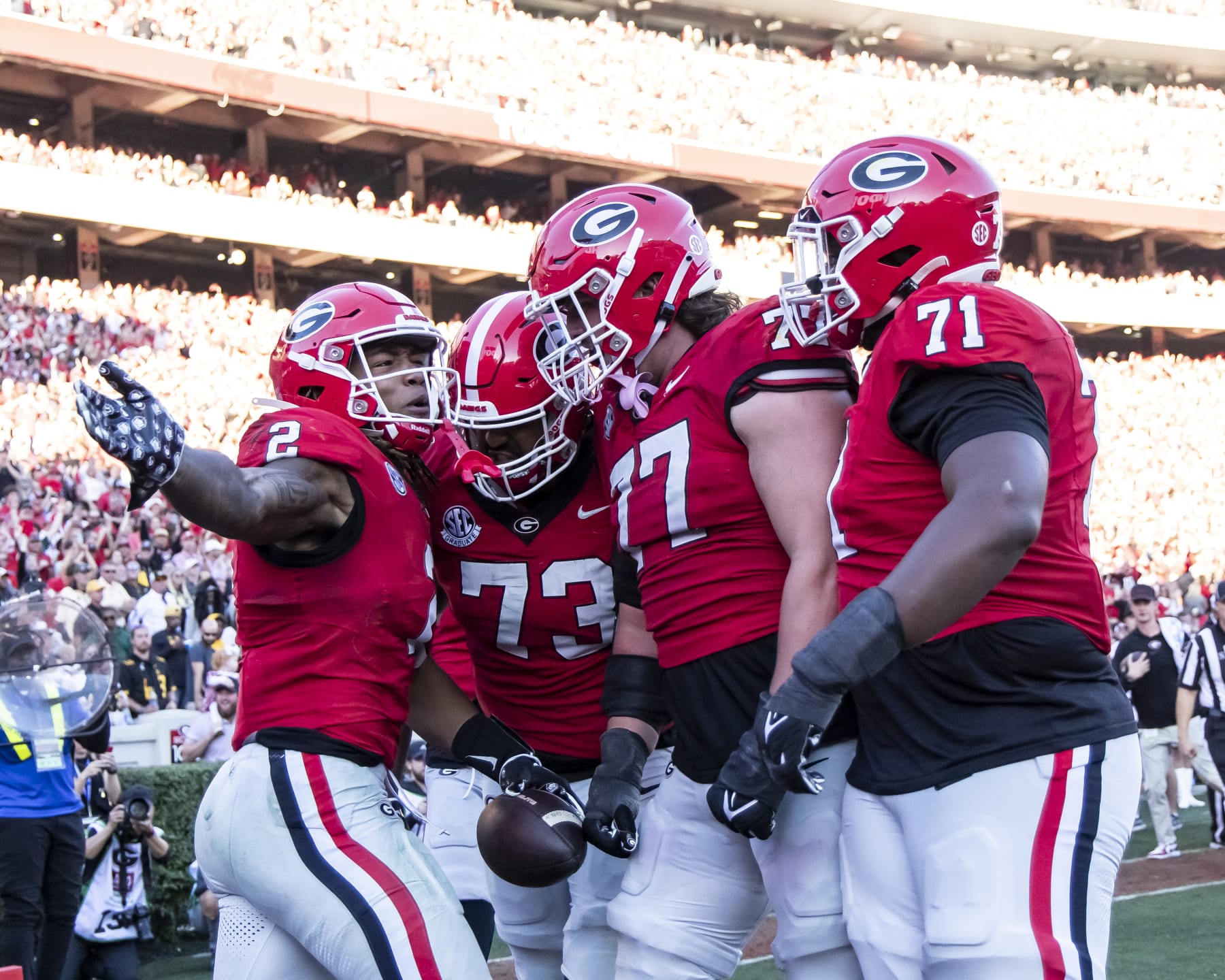 ATHENS, GA - NOVEMBER 4: Kendall Milton #2 of the Georgia Bulldogs celebrates a touchdown with the offensive line during a game between University of Missouri and University of Georgia at Sanford Stadium on November 4, 2023 in Athens, Georgia. (Photo by Steve Limentani/ISI Photos/Getty Images)