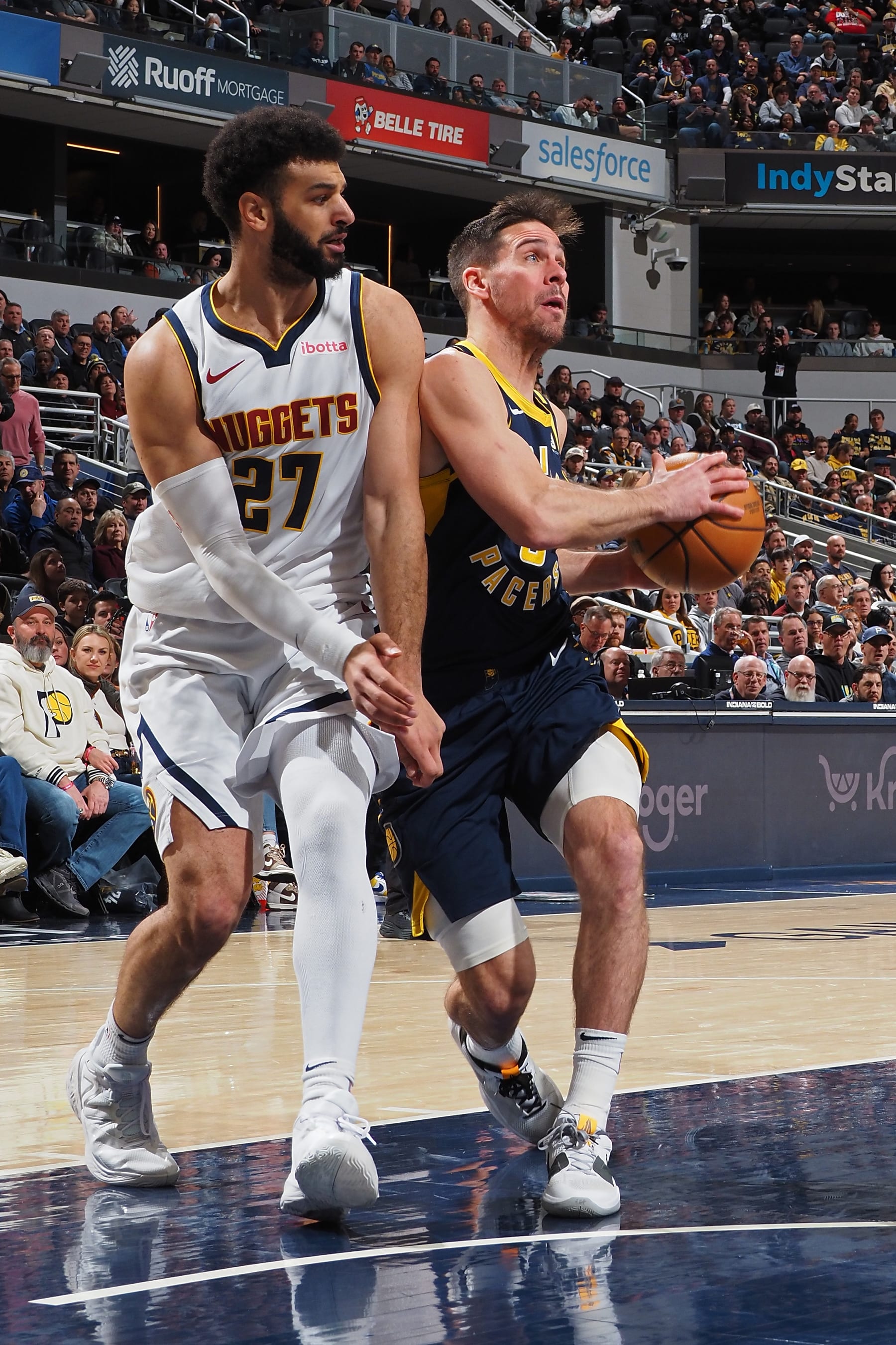 INDIANAPOLIS, IN - JANUARY 23:  T.J. McConnell #9 of the Indiana Pacers drives to the basket during the game against the Denver Nuggets on January 23, 2024 at Gainbridge Fieldhouse in Indianapolis, Indiana. NOTE TO USER: User expressly acknowledges and agrees that, by downloading and or using this Photograph, user is consenting to the terms and conditions of the Getty Images License Agreement. Mandatory Copyright Notice: Copyright 2024 NBAE (Photo by Ron Hoskins/NBAE via Getty Images)