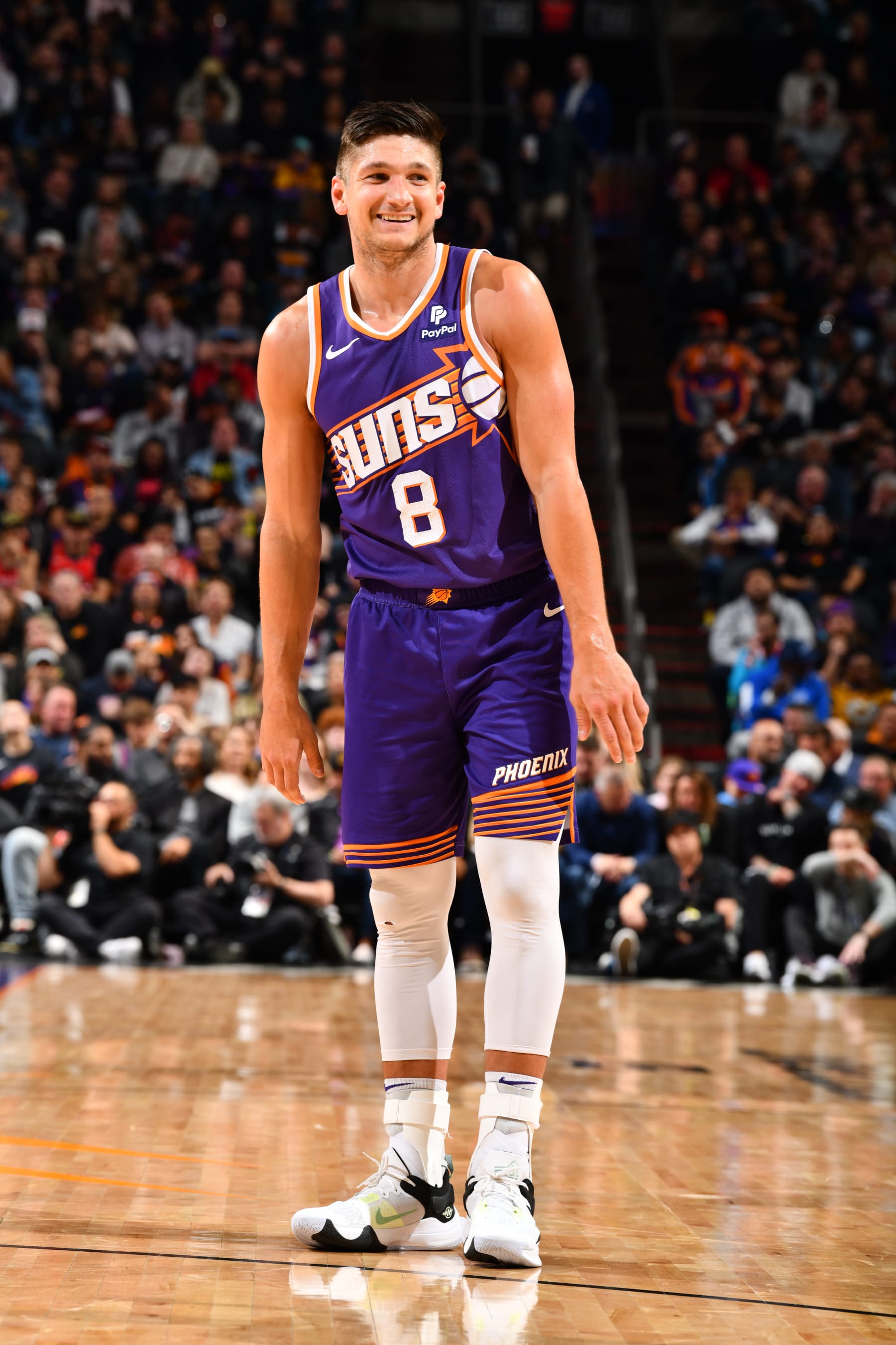 PHOENIX, AZ - MARCH 7: Grayson Allen #8 of the Phoenix Suns smiles during the game against the Toronto Raptors on March 7, 2024 at Footprint Center in Phoenix, Arizona. NOTE TO USER: User expressly acknowledges and agrees that, by downloading and or using this photograph, user is consenting to the terms and conditions of the Getty Images License Agreement. Mandatory Copyright Notice: Copyright 2024 NBAE (Photo by Barry Gossage/NBAE via Getty Images)