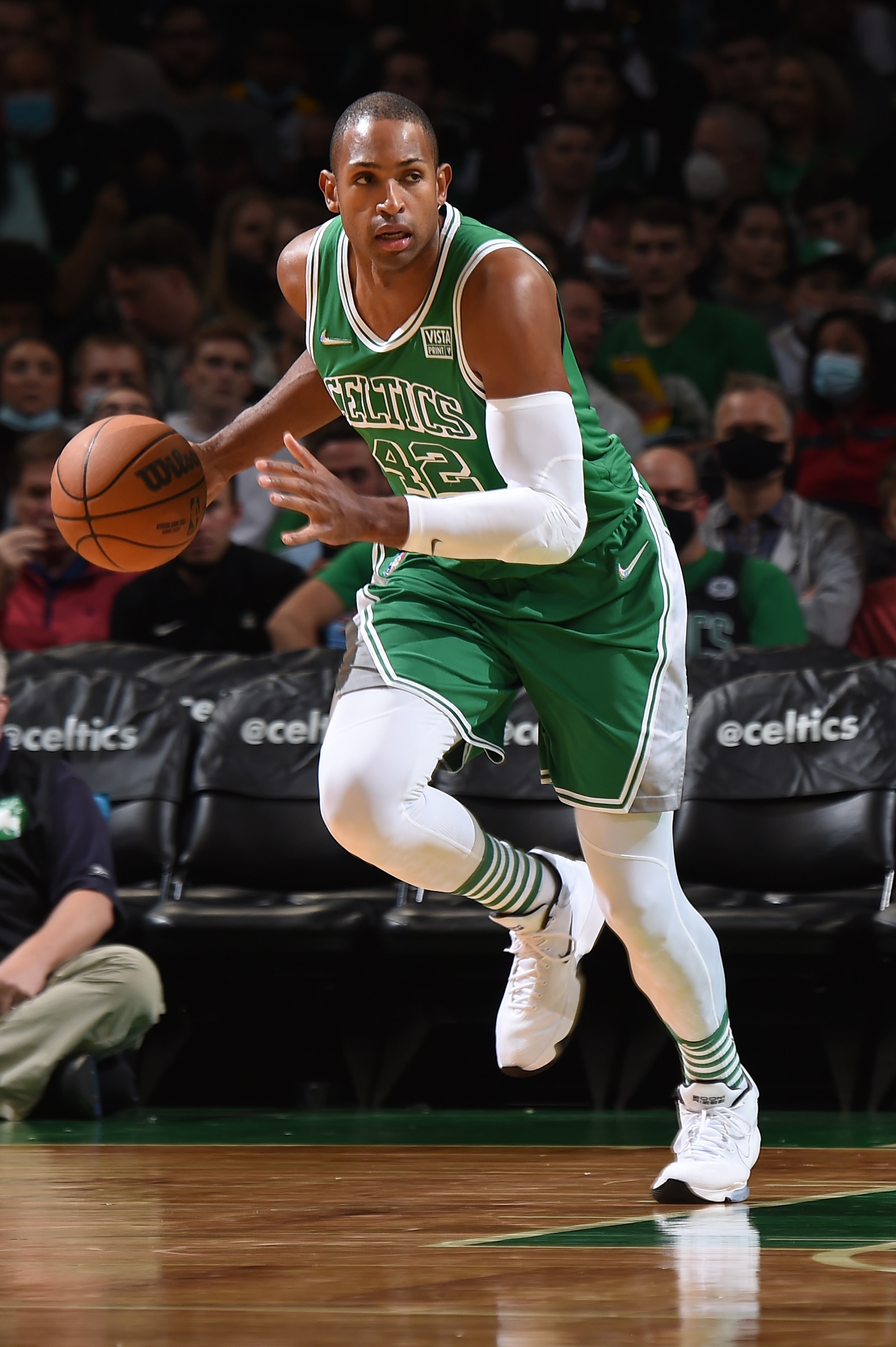 BOSTON, MA - NOVEMBER 12: Al Horford #42 of the Boston Celtics dribbles the ball during the game against the Milwaukee Bucks on November 12, 2021 at the TD Garden in Boston, Massachusetts.  NOTE TO USER: User expressly acknowledges and agrees that, by downloading and or using this photograph, User is consenting to the terms and conditions of the Getty Images License Agreement. Mandatory Copyright Notice: Copyright 2021 NBAE  (Photo by Brian Babineau/NBAE via Getty Images)