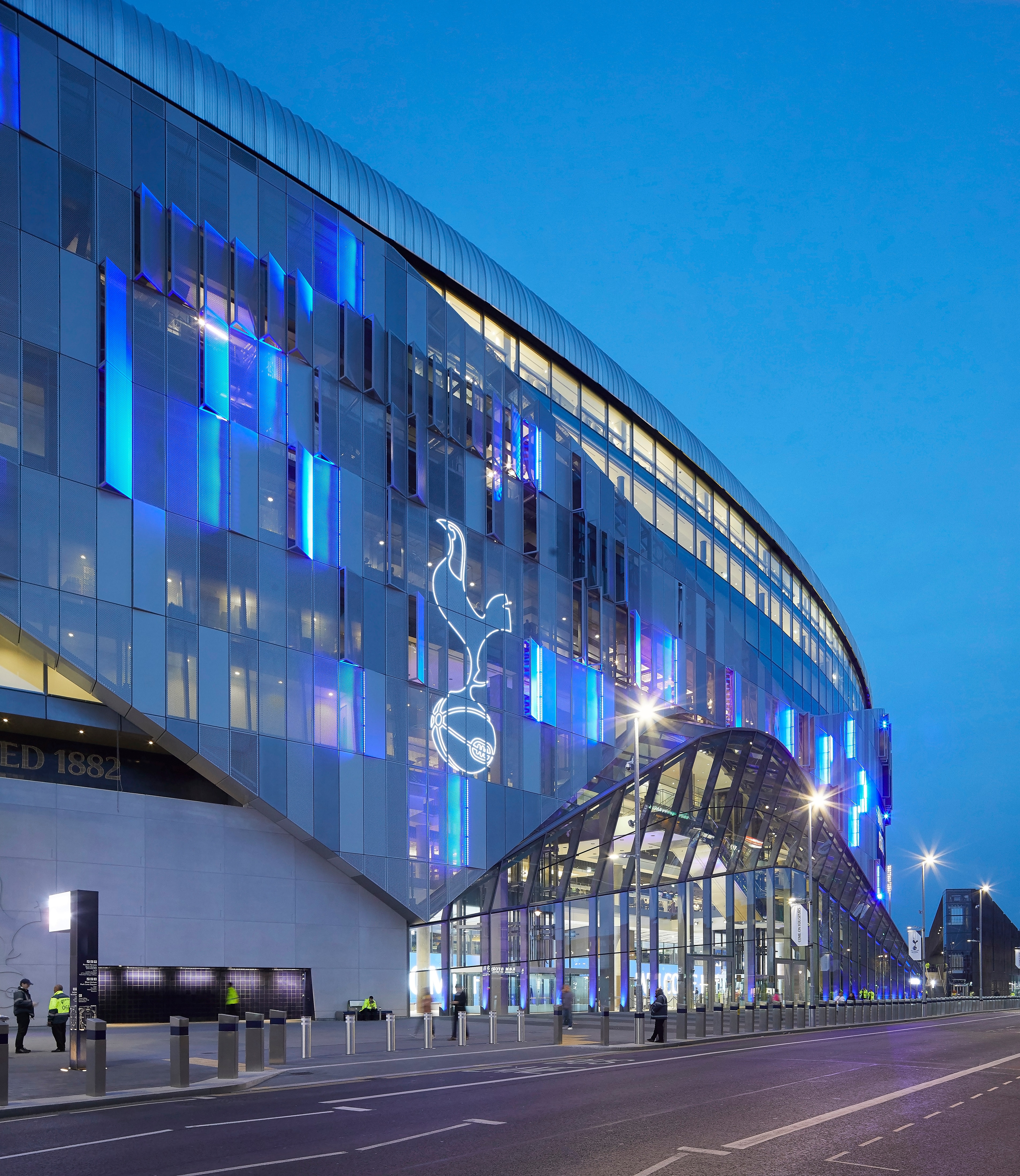 Night view of illuminated west entrance. The New Tottenham Hotspur Stadium, London, United Kingdom. Architect: Populous, 2019. (Photo by: View Pictures/Hufton+Crow/Universal Images Group via Getty Images)