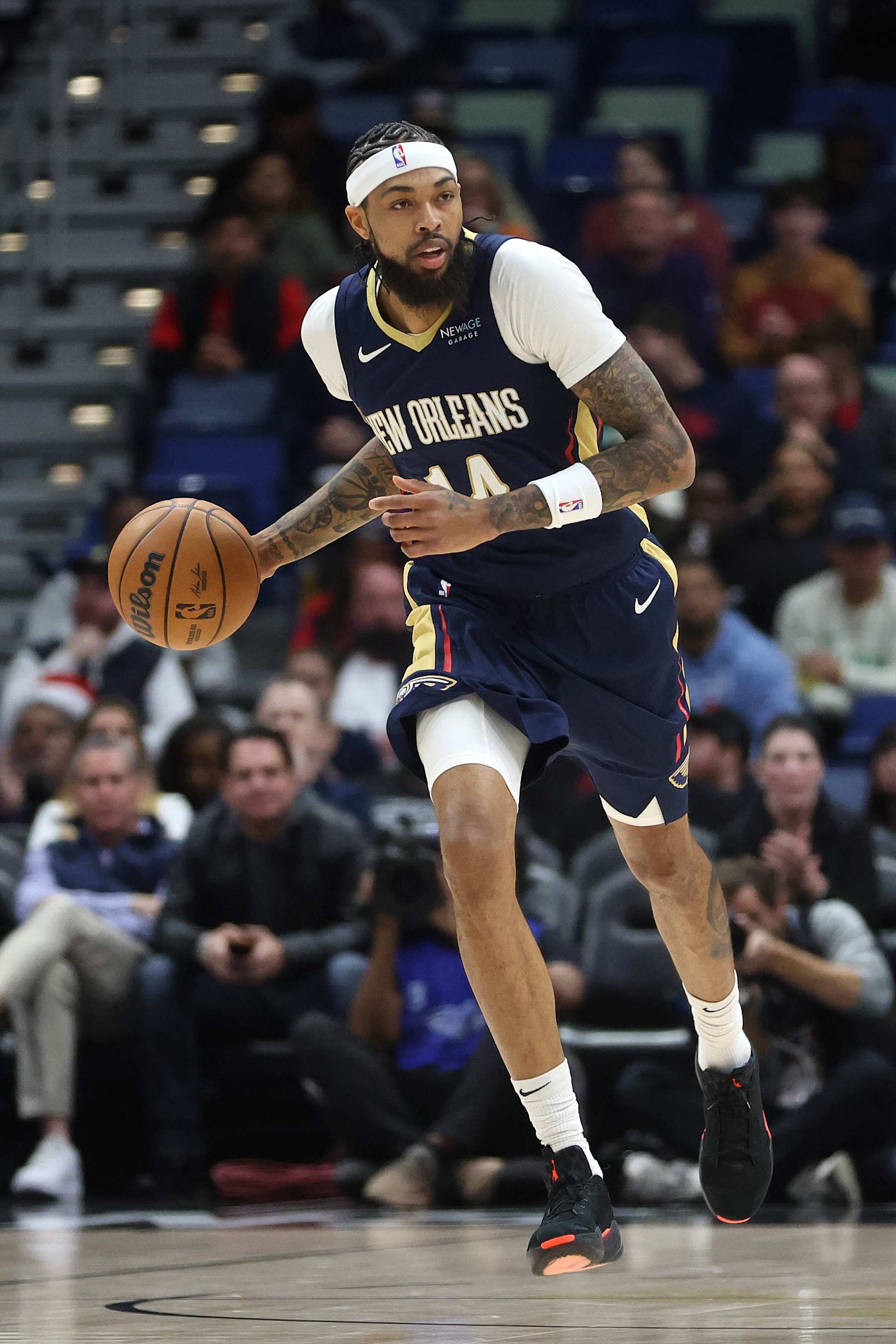 NEW ORLEANS, LOUISIANA - DECEMBER 05: Brandon Ingram #14 of the New Orleans Pelicans drives the ball against the Phoenix Suns at Smoothie King Center on December 05, 2024 in New Orleans, Louisiana. NOTE TO USER: User expressly acknowledges and agrees that, by downloading and or using this photograph, User is consenting to the terms and conditions of the Getty Images License Agreement.  (Photo by Chris Graythen/Getty Images)
