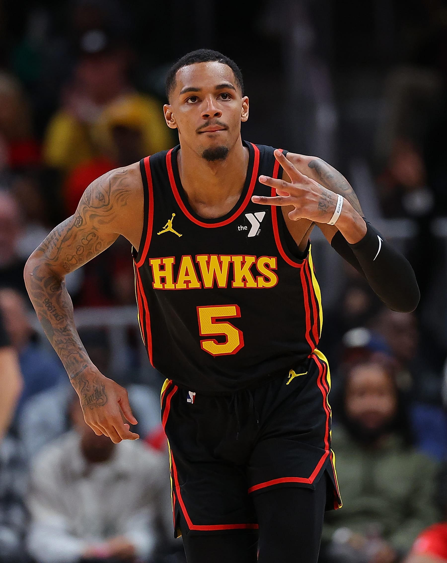 ATLANTA, GEORGIA - FEBRUARY 05:  Dejounte Murray #5 of the Atlanta Hawks reacts after hitting a three-point basket against the LA Clippers during the fourth quarter at State Farm Arena on February 05, 2024 in Atlanta, Georgia.  NOTE TO USER: User expressly acknowledges and agrees that, by downloading and/or using this photograph, user is consenting to the terms and conditions of the Getty Images License Agreement.  (Photo by Kevin C. Cox/Getty Images)