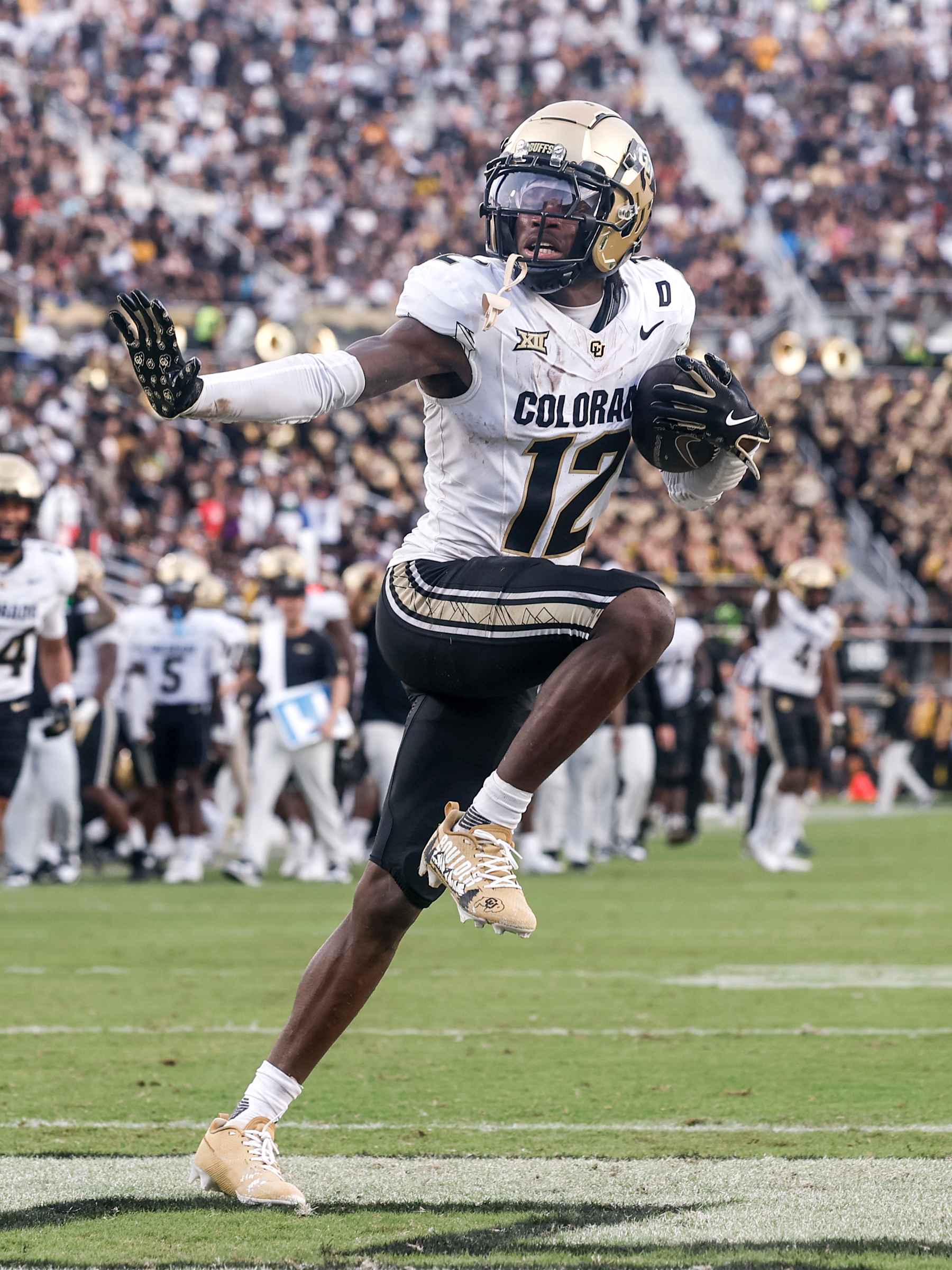 ORLANDO, FL - SEPTEMBER 28: Cornerback Travis Hunter #12 of the Colorado Buffaloes hits the Heisman Pose after making an interception during the game against the UCF Knights at FBC Mortgage Stadium on September 28, 2024 in Orlando, Florida. The Buffaloes defeated the Knights 48 to 21. (Photo by Don Juan Moore/Getty Images)