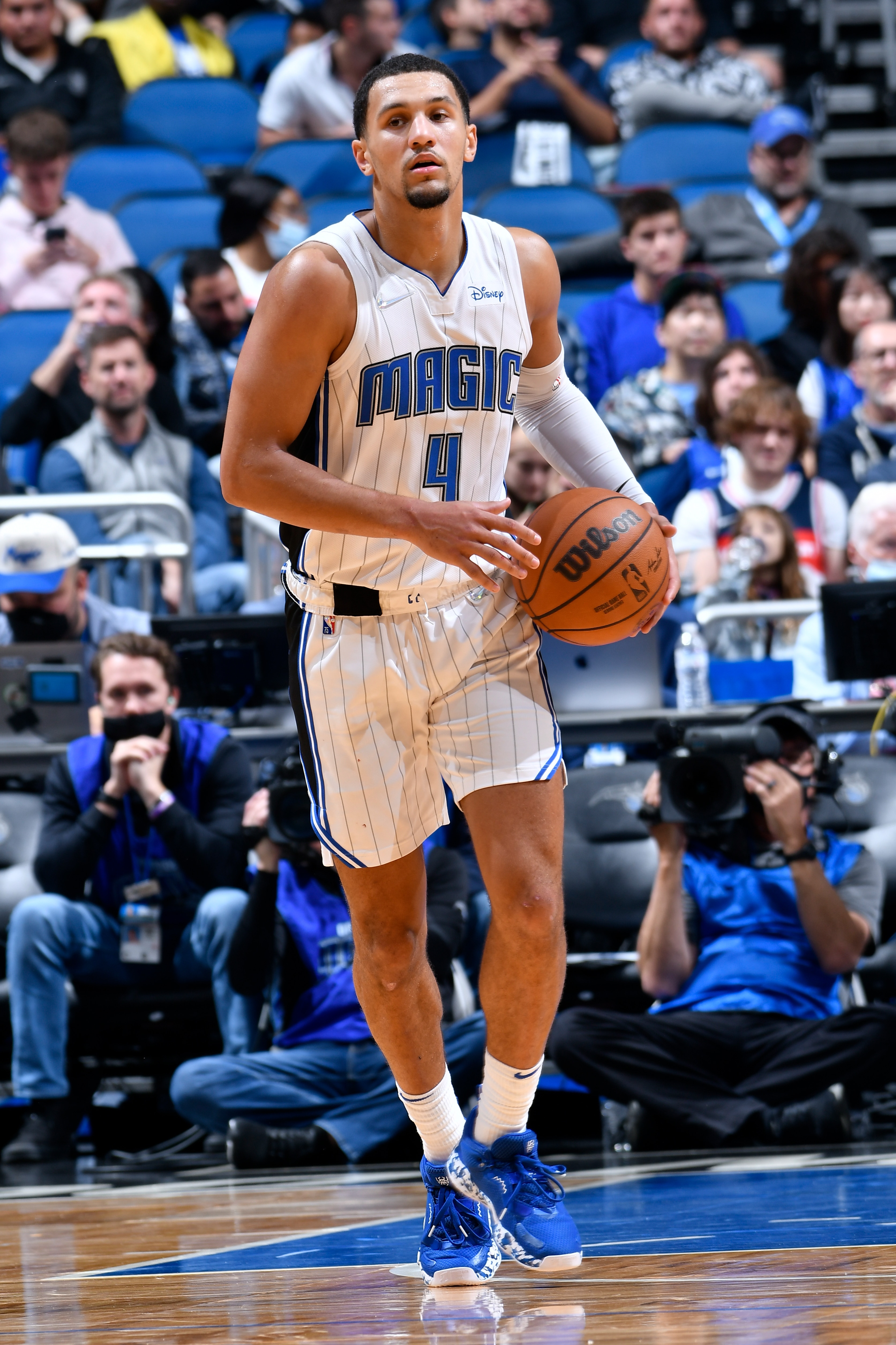ORLANDO, FL - NOVEMBER 13: Jalen Suggs #4 of the Orlando Magic handles the ball during the game against the Washington Wizards on November 13, 2021 at Amway Center in Orlando, Florida. NOTE TO USER: User expressly acknowledges and agrees that, by downloading and or using this photograph, User is consenting to the terms and conditions of the Getty Images License Agreement. Mandatory Copyright Notice: Copyright 2021 NBAE (Photo by Fernando Medina/NBAE via Getty Images) ORLANDO, FL - NOVEMBER 13: Jalen Suggs #4 of the Orlando Magic handles the ball during the game against the Washington Wizards on November 13, 2021 at Amway Center in Orlando, Florida. NOTE TO USER: User expressly acknowledges and agrees that, by downloading and or using this photograph, User is consenting to the terms and conditions of the Getty Images License Agreement. Mandatory Copyright Notice: Copyright 2021 NBAE (Photo by Fernando Medina/NBAE via Getty Images)