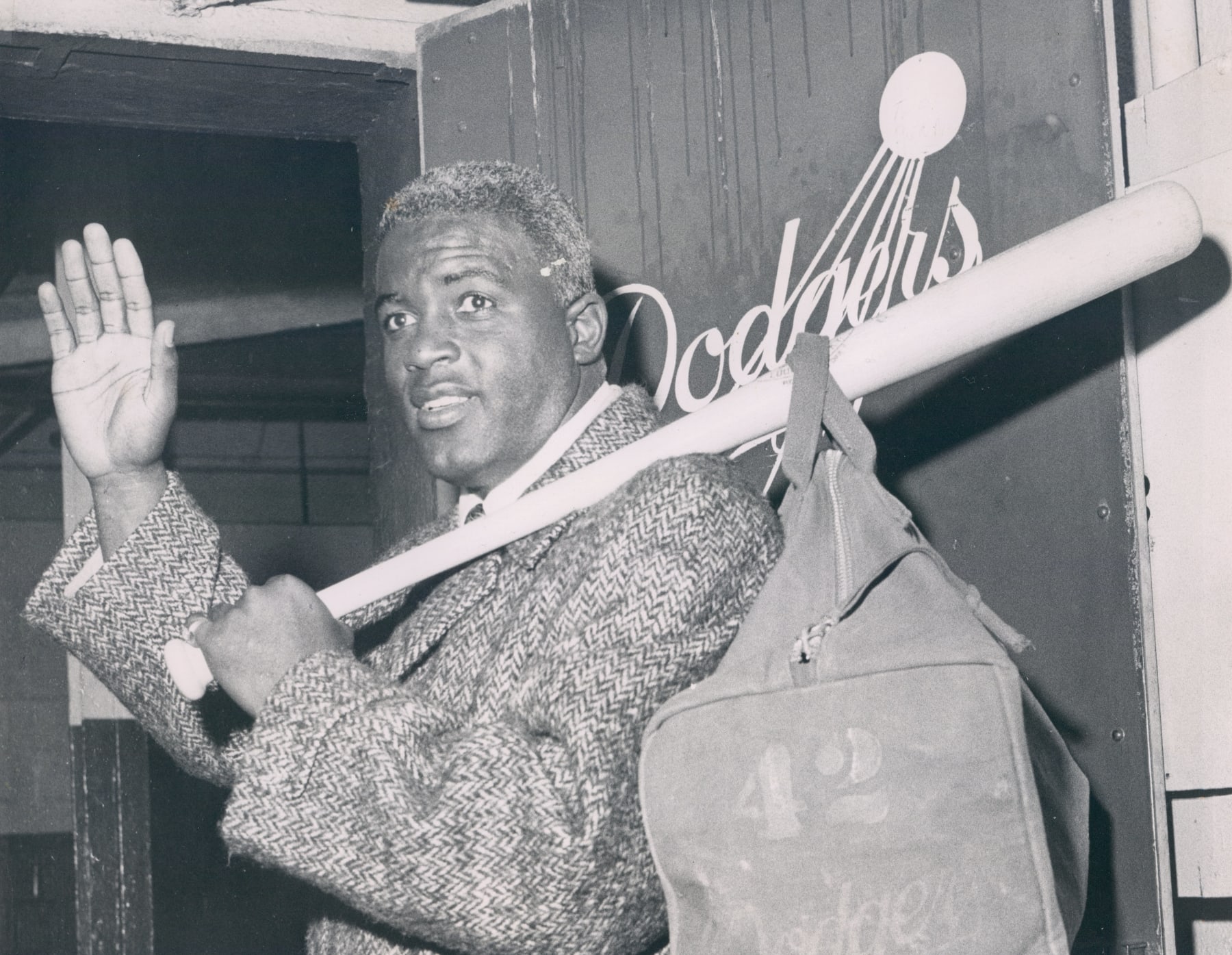 BROOKLYN, NY - 1957: Brooklyn Dodger Jackie Robinson photographed as he picks up his gear and leaves Ebbets Field for the last time in January, 1957. (Photo by Barney Stein/Sports Studio Photos/Getty Images) 
