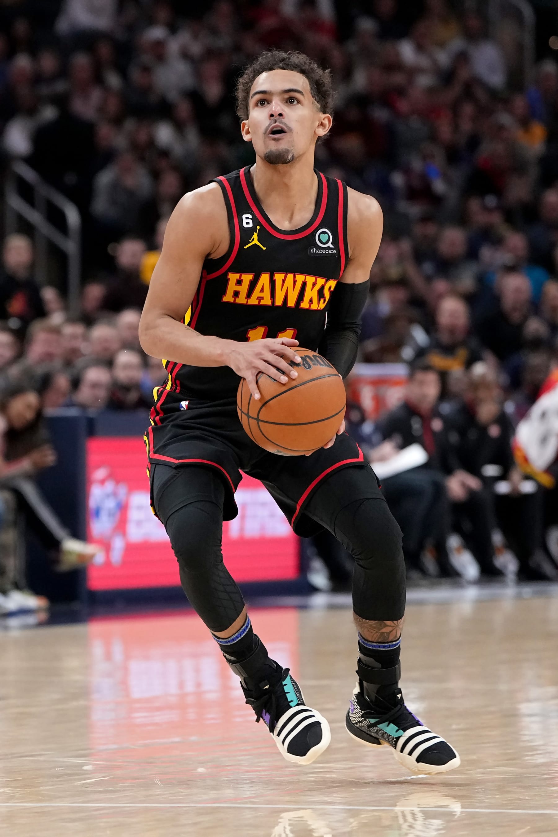 INDIANAPOLIS, INDIANA - JANUARY 13: Trae Young #11 of the Atlanta Hawks dribbles the ball in the fourth quarter against the Indiana Pacers at Gainbridge Fieldhouse on January 13, 2023 in Indianapolis, Indiana. NOTE TO USER: User expressly acknowledges and agrees that, by downloading and or using this photograph, User is consenting to the terms and conditions of the Getty Images License Agreement. (Photo by Dylan Buell/Getty Images)