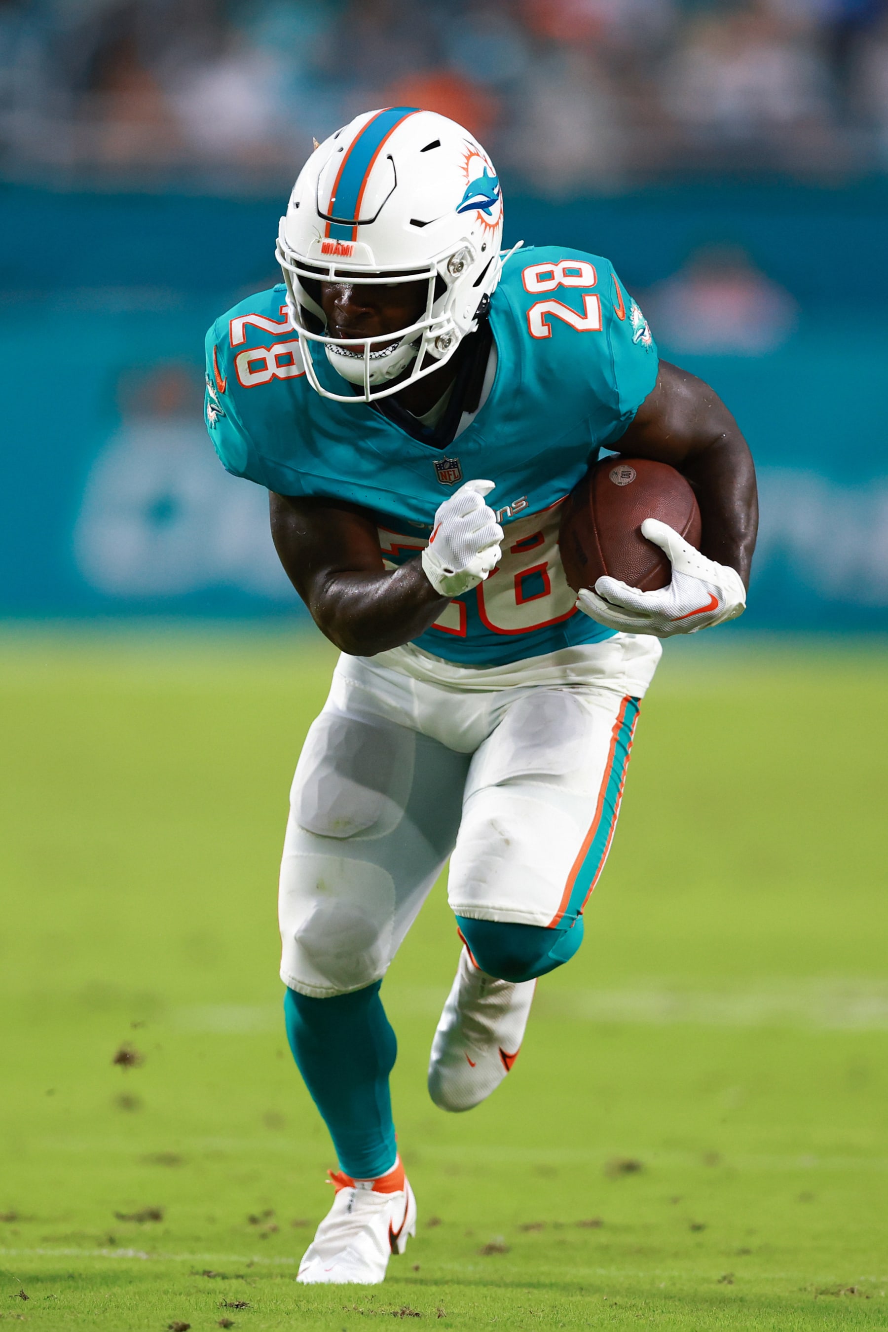 MIAMI GARDENS, FLORIDA - AUGUST 11: De'Von Achane #28 of the Miami Dolphins carries the ball against the Atlanta Falcons during the second quarter in a preseason game at Hard Rock Stadium on August 11, 2023 in Miami Gardens, Florida. (Photo by Megan Briggs/Getty Images)