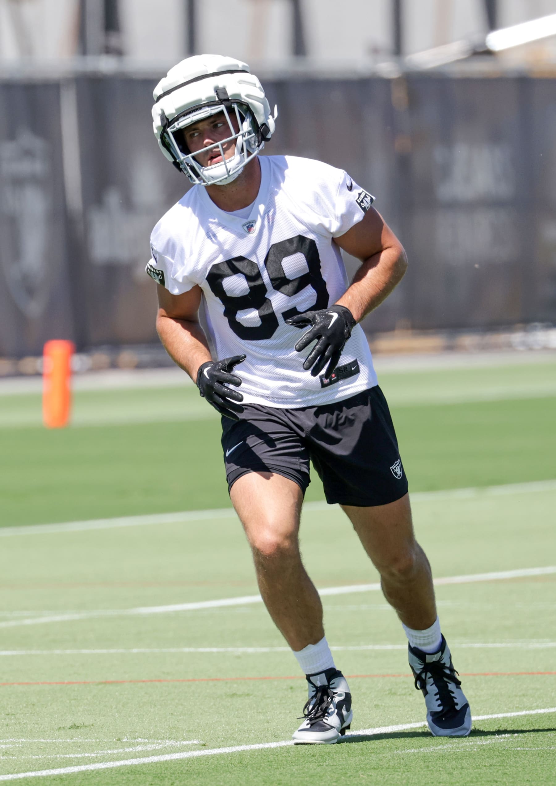 HENDERSON, NEVADA - MAY 29: Tight end Brock Bowers #89 of the Las Vegas Raiders runs through a drill during an OTA offseason workout at the Las Vegas Raiders Headquarters/Intermountain Healthcare Performance Center on May 29, 2024 in Henderson, Nevada. (Photo by Ethan Miller/Getty Images)