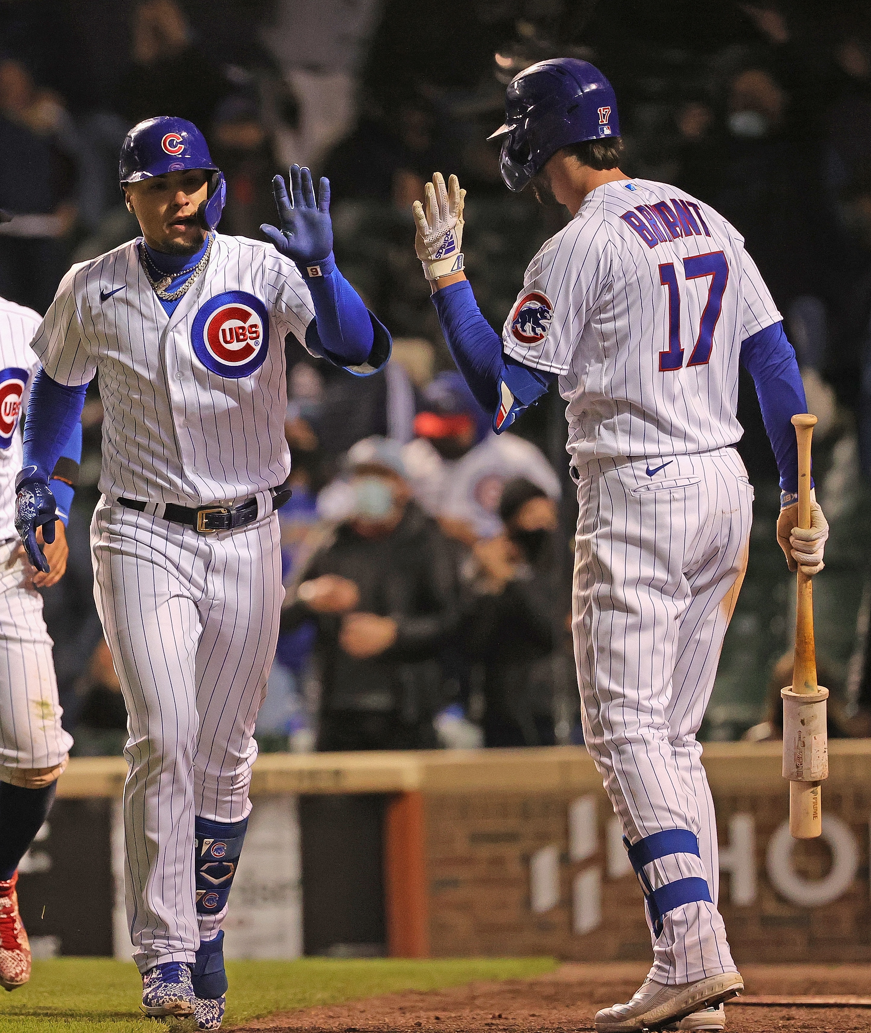 CHICAGO, ILLINOIS - MAY 04: Javier Baez #9 of the Chicago Cubs is congratulated by Kris Bryant #17 after hitting the game-tying home run against the Los Angeles Dodgers at Wrigley Field on May 04, 2021 in Chicago, Illinois. The Cubs defeated the Dodgers 4-3 in 9 innings. (Photo by Jonathan Daniel/Getty Images)