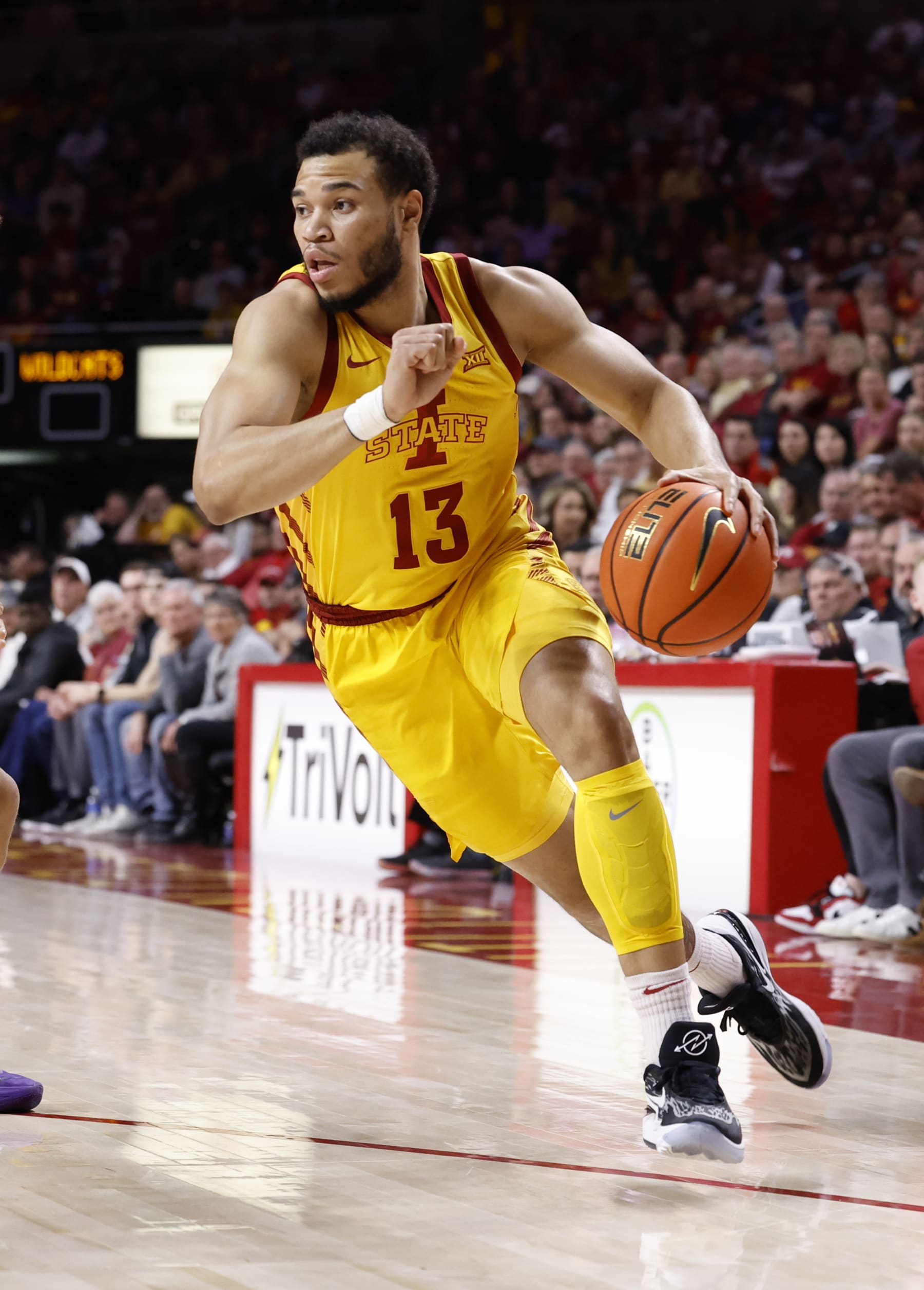 AMES, IA - JANUARY 24:  Jaren Holmes #13 of the Iowa State Cyclones drives the ball in the first half of play at Hilton Coliseum on January 24, 2023 in Ames, Iowa. The Iowa State Cyclones won 80-76 over Kansas State Wildcats. (Photo by David K Purdy/Getty Images)