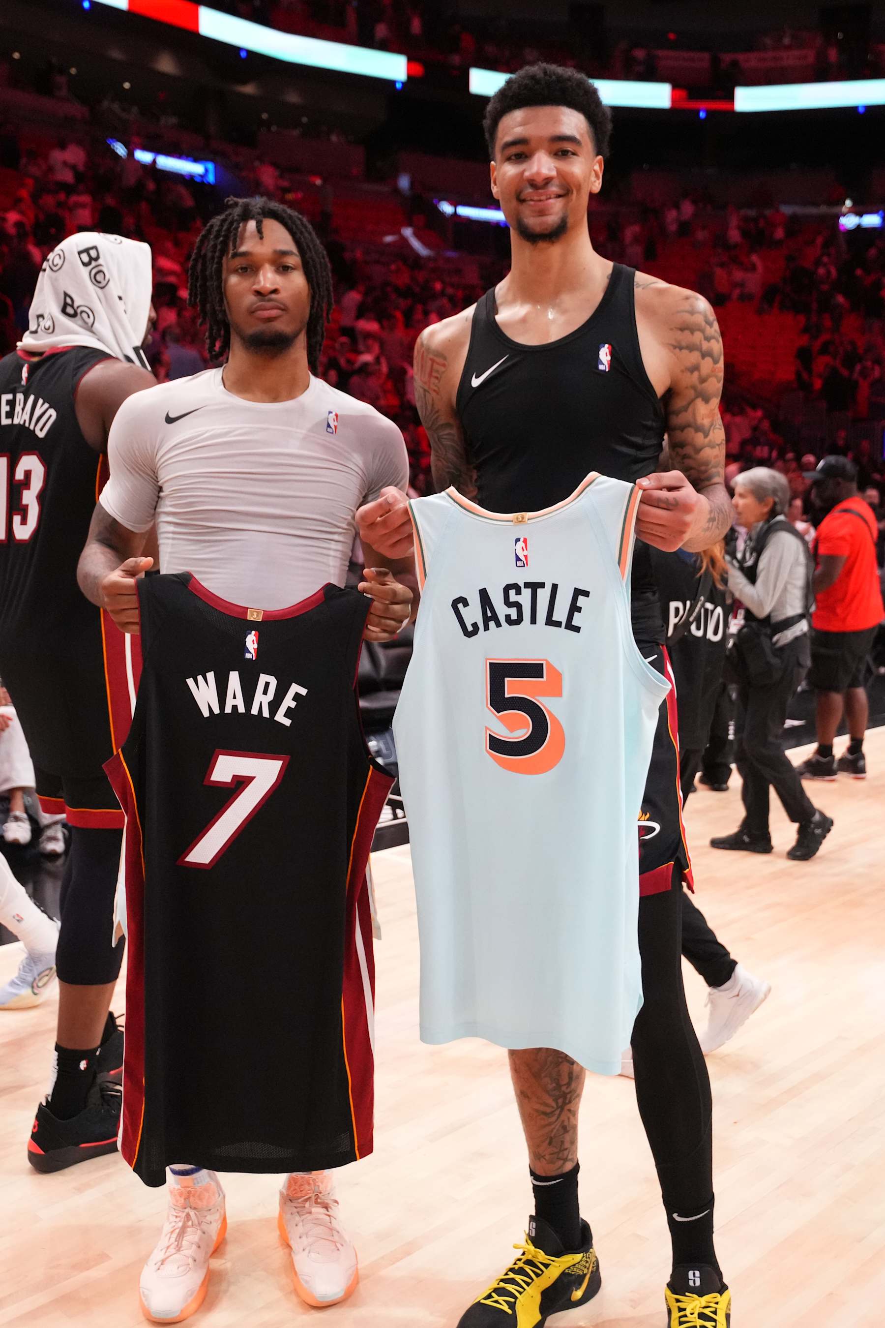MIAMI, FL - JANURARY 19: Stephon Castle #5 of the San Antonio Spurs and Kel'el Ware #7 of the Miami Heat swap jerseys after the game on January 19, 2025 at Kaseya Center in Miami, Florida. NOTE TO USER: User expressly acknowledges and agrees that, by downloading and or using this Photograph, user is consenting to the terms and conditions of the Getty Images License Agreement. Mandatory Copyright Notice: Copyright 2025 NBAE (Photo by Jesse D. Garrabrant/NBAE via Getty Images)