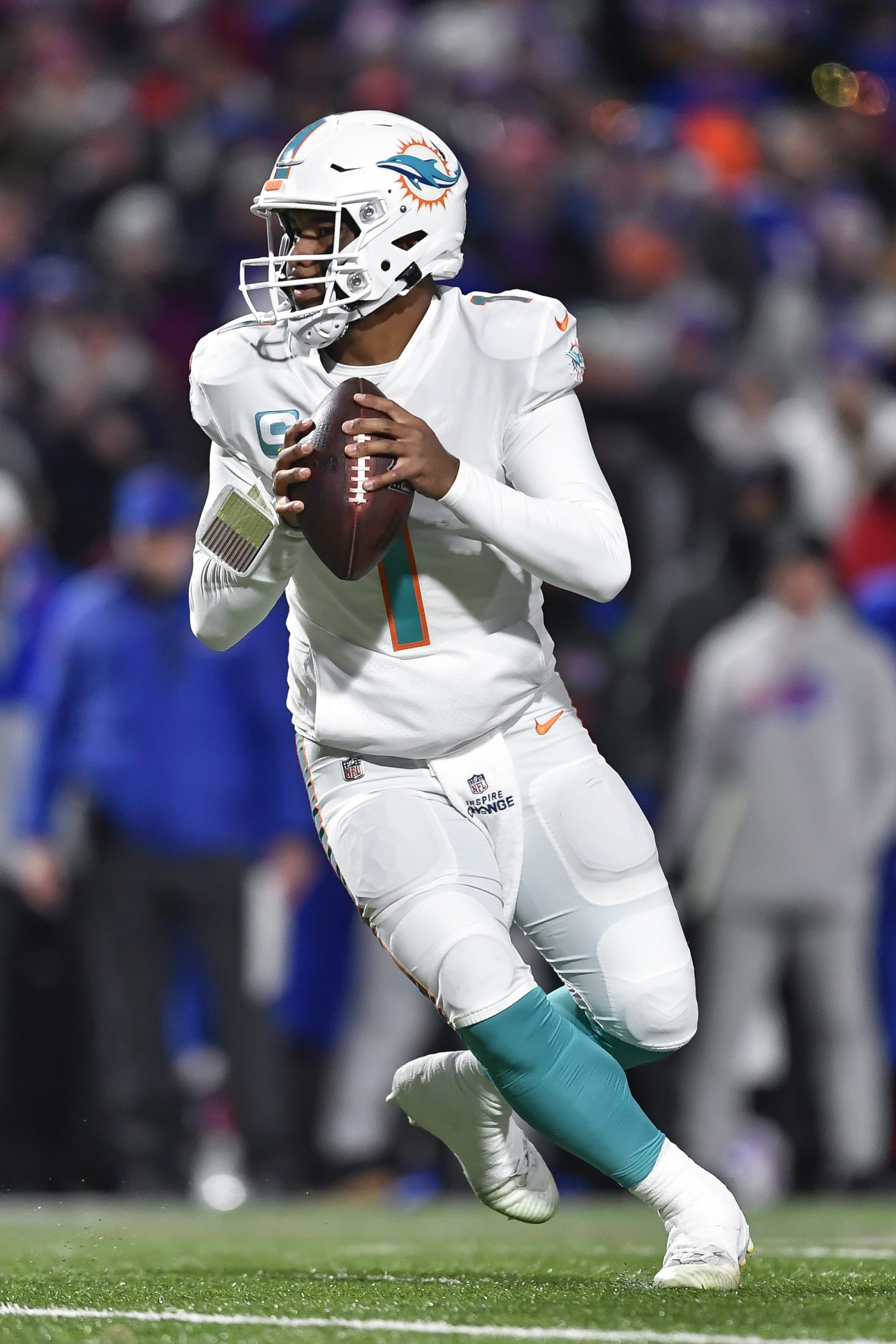 Miami Dolphins quarterback Tua Tagovailoa (1) looks to pass during the first half of an NFL football game against the Buffalo Bills in Orchard Park, N.Y., Saturday, Dec. 17, 2022. (AP Photo/Adrian Kraus)