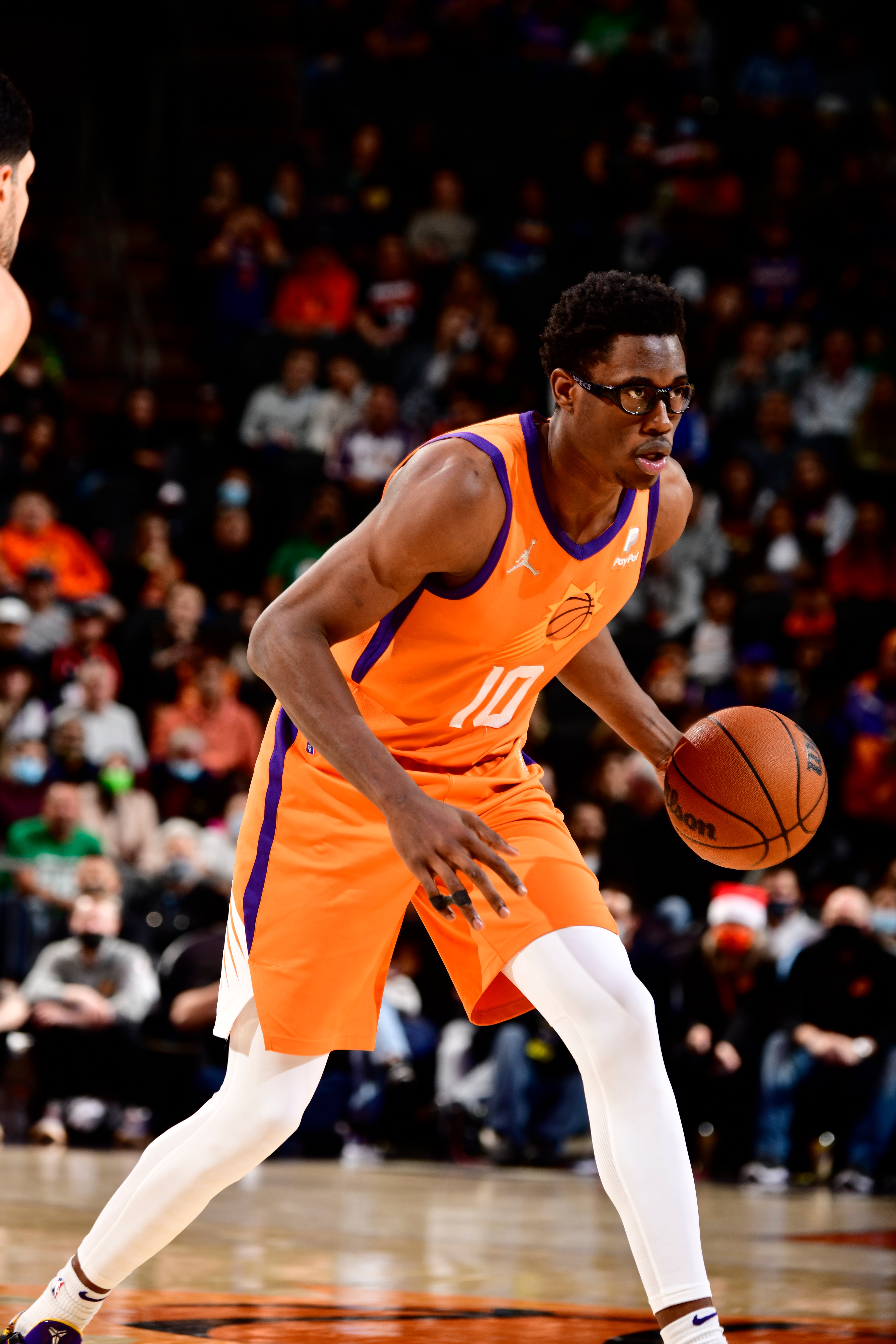 PHOENIX, AZ - DECEMBER 10: Jalen Smith #10 of the Phoenix Suns dribbles the ball during the game against the Boston Celtics on December 10, 2021 at Footprint Center in Phoenix, Arizona. NOTE TO USER: User expressly acknowledges and agrees that, by downloading and or using this photograph, user is consenting to the terms and conditions of the Getty Images License Agreement. Mandatory Copyright Notice: Copyright 2021 NBAE (Photo by Barry Gossage/NBAE via Getty Images)