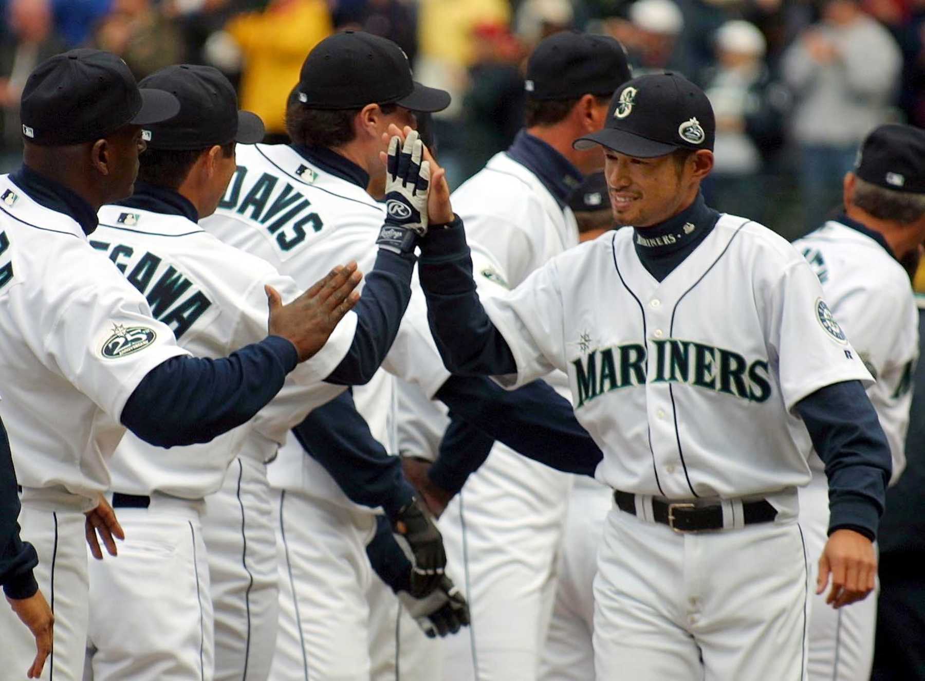 SEATTLE, UNITED STATES:  Seattle Mariners Ichiro Suzuki (R) is introduced during pre-game ceremonies before the Mariners game against the Chicago White Sox, in Seattle, 01 April 2002. Ichiro was selected the 2001 American League MVP and Rookie of the Year. AFP PHOTO/Dan LEVINE (Photo credit should read DAN LEVINE/AFP via Getty Images)