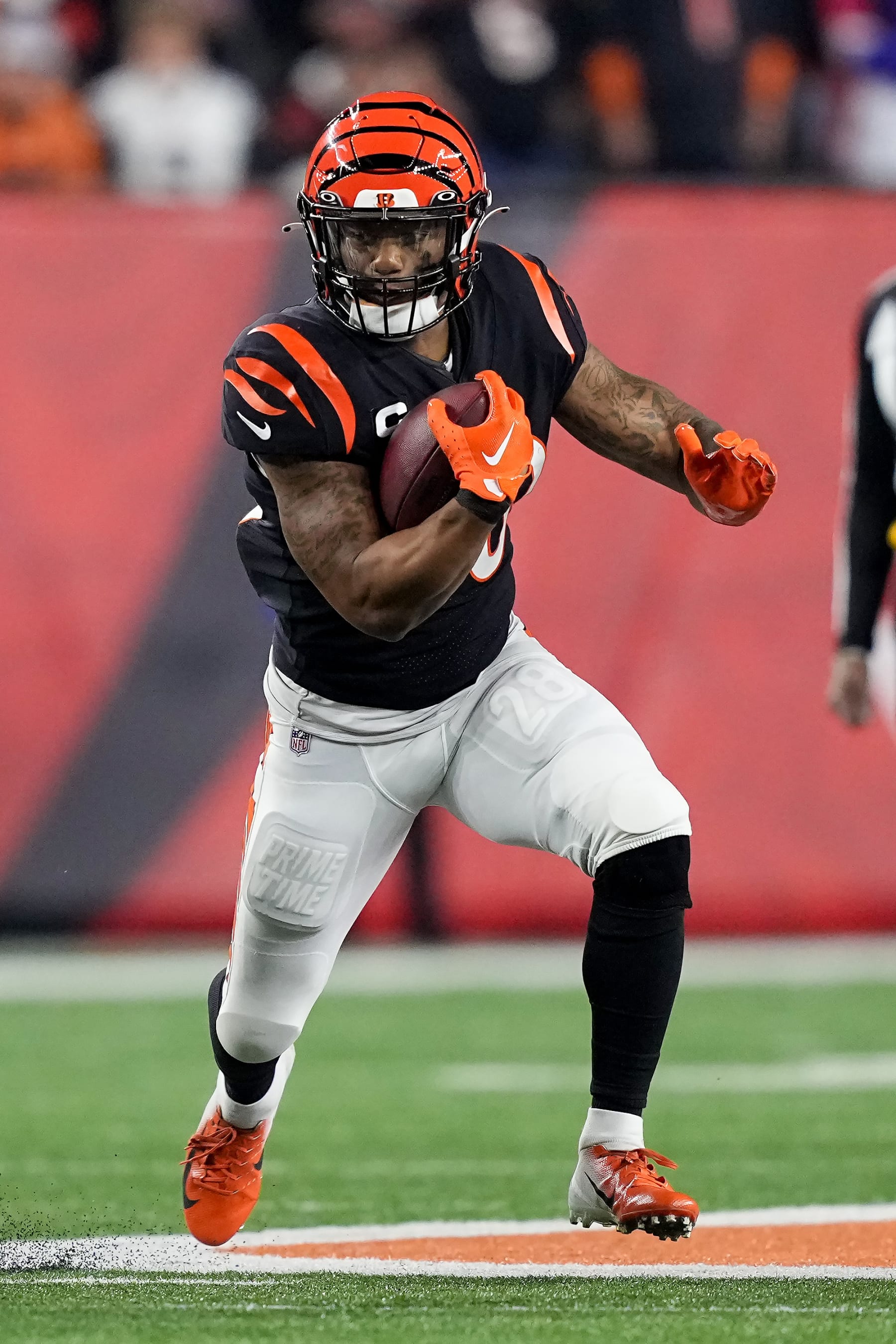 CINCINNATI, OHIO - JANUARY 02: Joe Mixon #28 of the Cincinnati Bengals runs with the ball in the first quarter against the Buffalo Bills at Paycor Stadium on January 02, 2023 in Cincinnati, Ohio. (Photo by Dylan Buell/Getty Images)