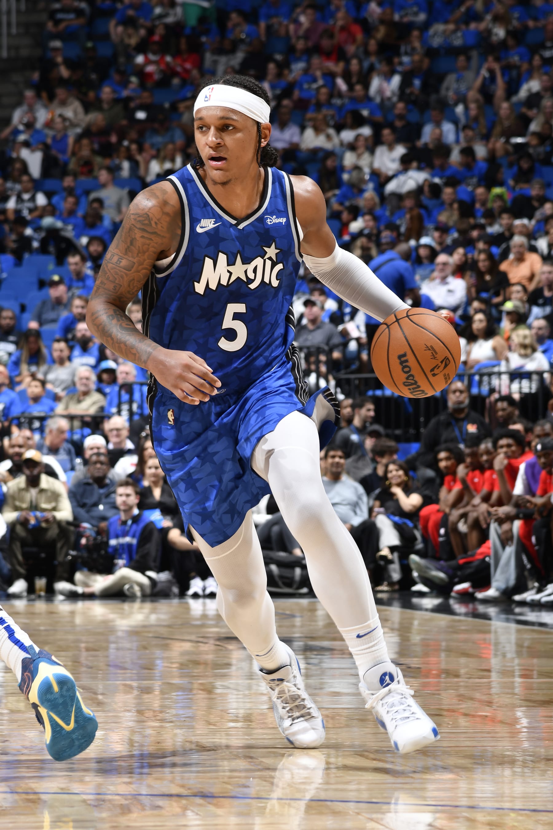 ORLANDO, FL - OCTOBER 25: Paolo Banchero #5 of the Orlando Magic dribbles the ball during the game against the Houston Rockets on October 25, 2023 at Amway Center in Orlando, Florida. NOTE TO USER: User expressly acknowledges and agrees that, by downloading and or using this photograph, User is consenting to the terms and conditions of the Getty Images License Agreement. Mandatory Copyright Notice: Copyright 2023 NBAE (Photo by Fernando Medina/NBAE via Getty Images)