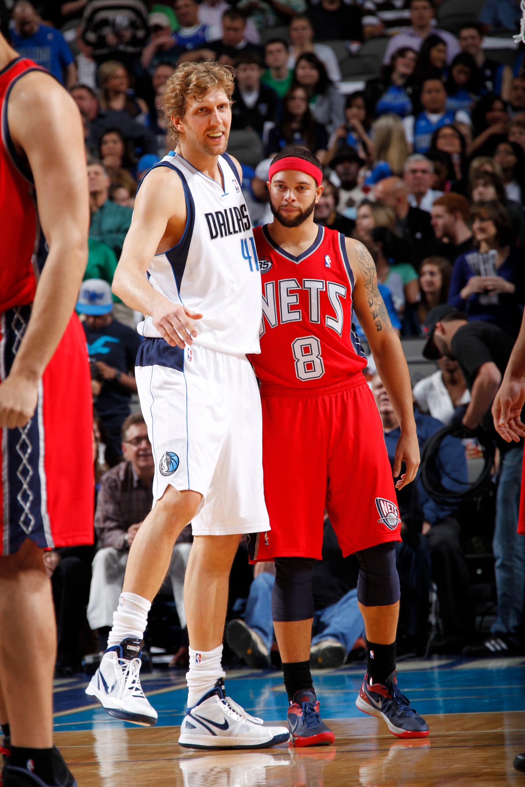 DALLAS, TX - FEBRUARY 28:  Dirk Nowitzki #41 of the Dallas Mavericks greets Deron Williams #8 of the New Jersey Nets before a game on February 28, 2012 at the American Airlines Center in Dallas, Texas. NOTE TO USER: User expressly acknowledges and agrees that, by downloading and or using this photograph, User is consenting to the terms and conditions of the Getty Images License Agreement. Mandatory Copyright Notice: Copyright 2012 NBAE (Photo by Glenn James/NBAE via Getty Images)