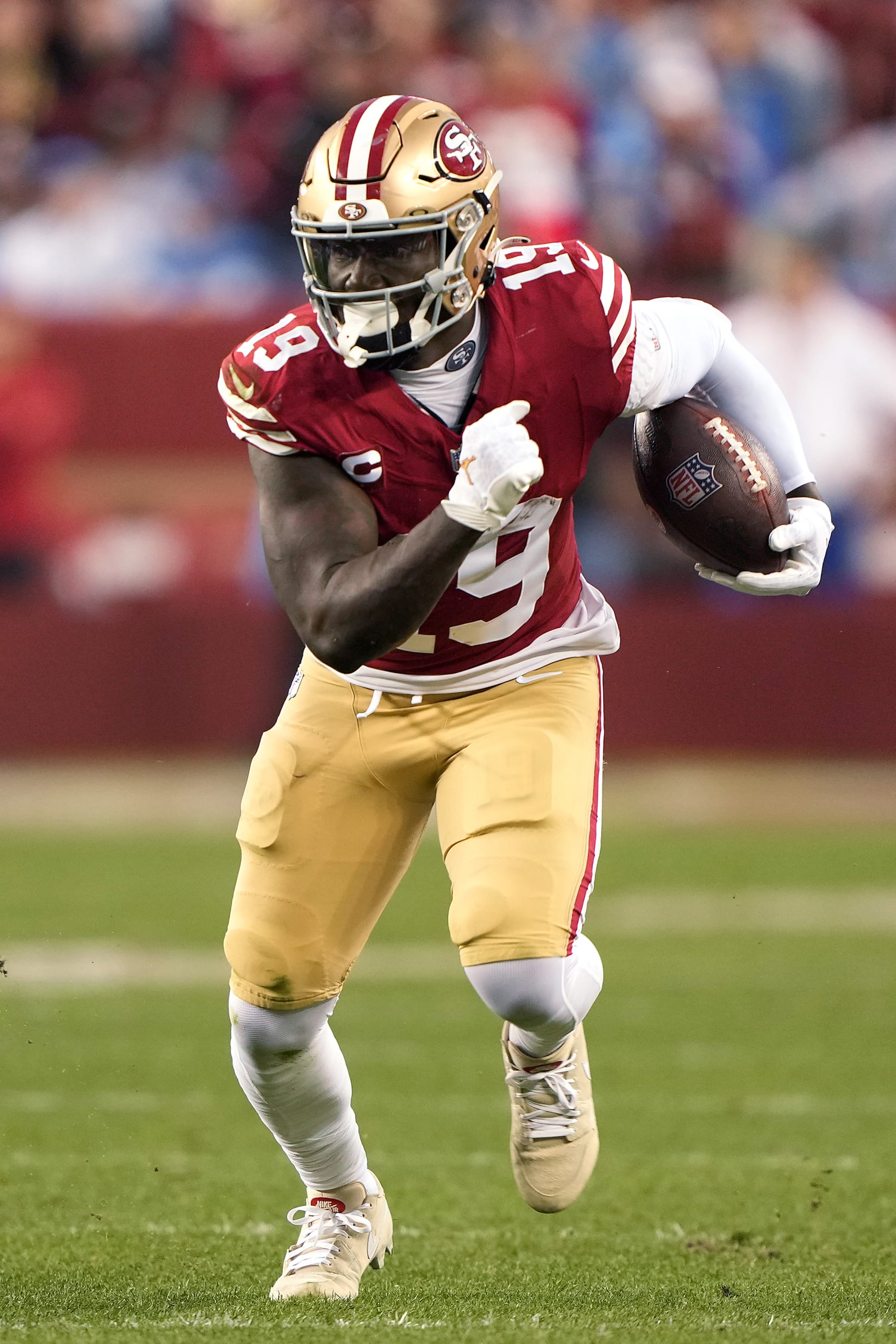 SANTA CLARA, CALIFORNIA - JANUARY 28: Deebo Samuel #19 of the San Francisco 49ers runs with the ball during the third quarter against the Detroit Lions in the NFC Championship Game at Levi's Stadium on January 28, 2024 in Santa Clara, California. (Photo by Thearon W. Henderson/Getty Images)