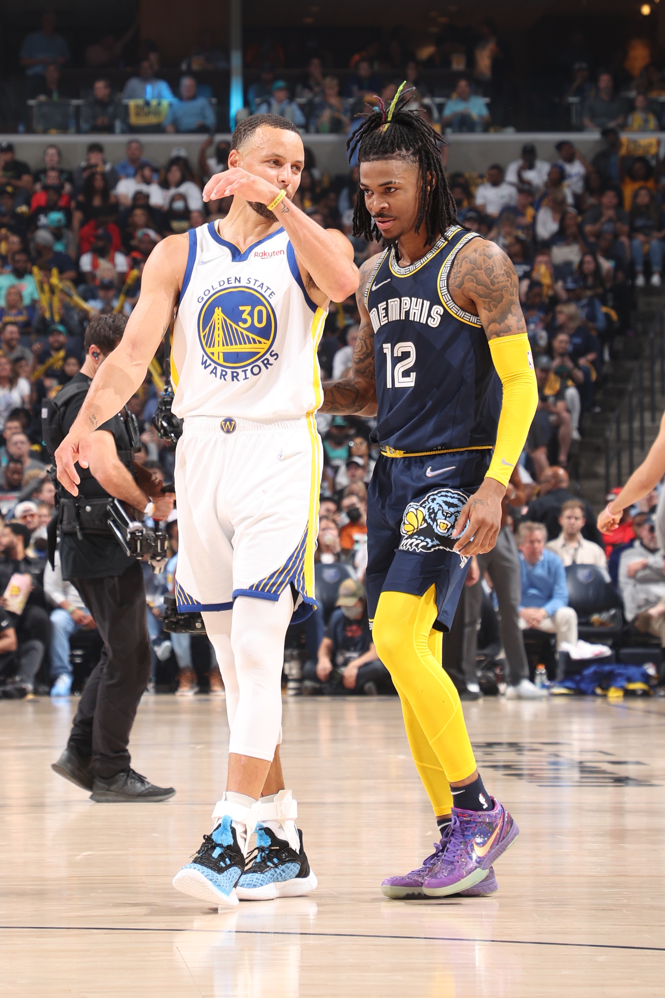 MEMPHIS, TN - MAY 3: Stephen Curry #30 of the Golden State Warriors talks with Ja Morant #12 of the Memphis Grizzlies during Game 2 of the 2022 NBA Playoffs Western Conference Semifinals on May 3, 2022 at FedExForum in Memphis, Tennessee. NOTE TO USER: User expressly acknowledges and agrees that, by downloading and or using this photograph, User is consenting to the terms and conditions of the Getty Images License Agreement. Mandatory Copyright Notice: Copyright 2022 NBAE (Photo by Joe Murphy/NBAE via Getty Images)