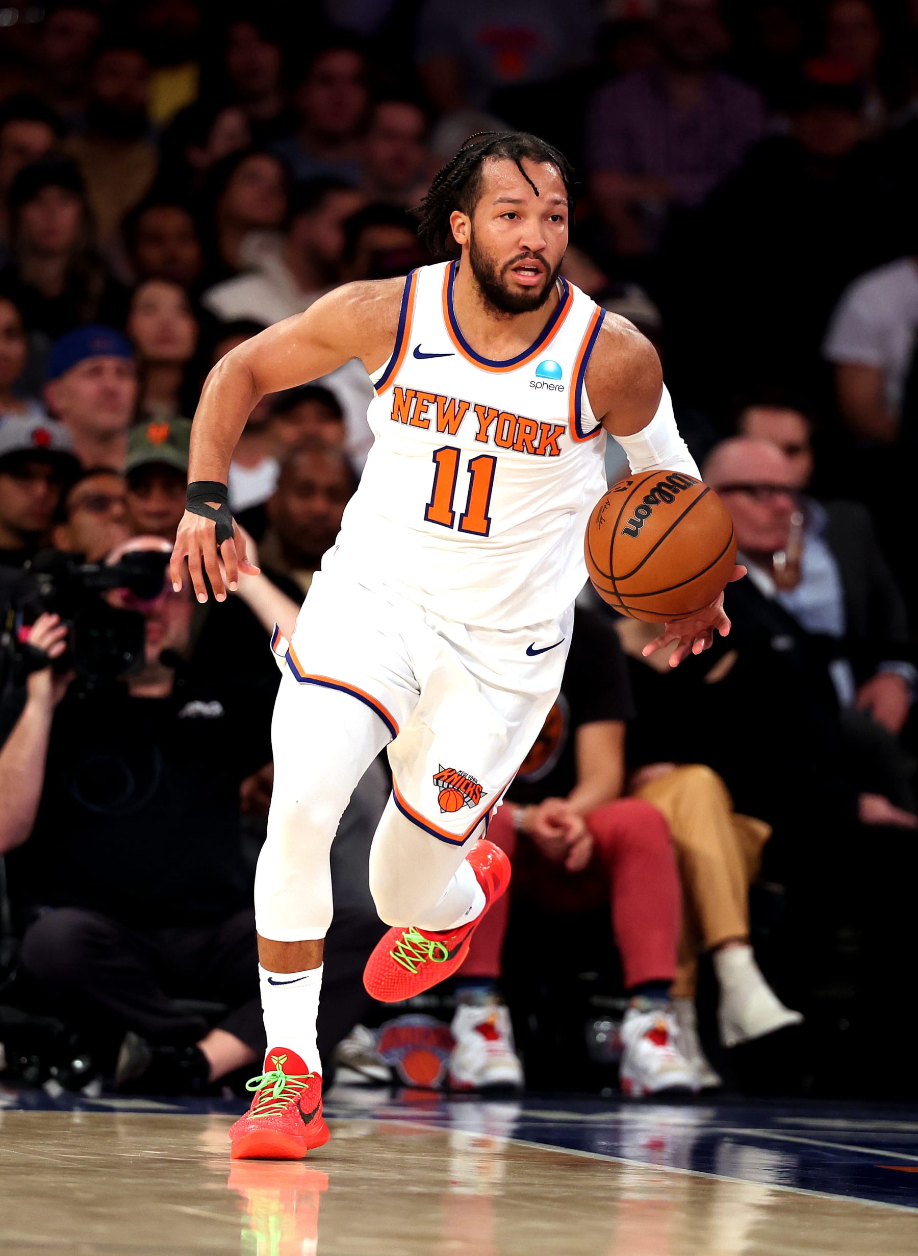 NEW YORK, NEW YORK - DECEMBER 11:  Jalen Brunson #11 of the New York Knicks drives against the Toronto Raptors during their game at Madison Square Garden on December 11, 2023 in New York City.  User expressly acknowledges and agrees that, by downloading and or using this photograph, User is consenting to the terms and conditions of the Getty Images License Agreement.   (Photo by Al Bello/Getty Images)