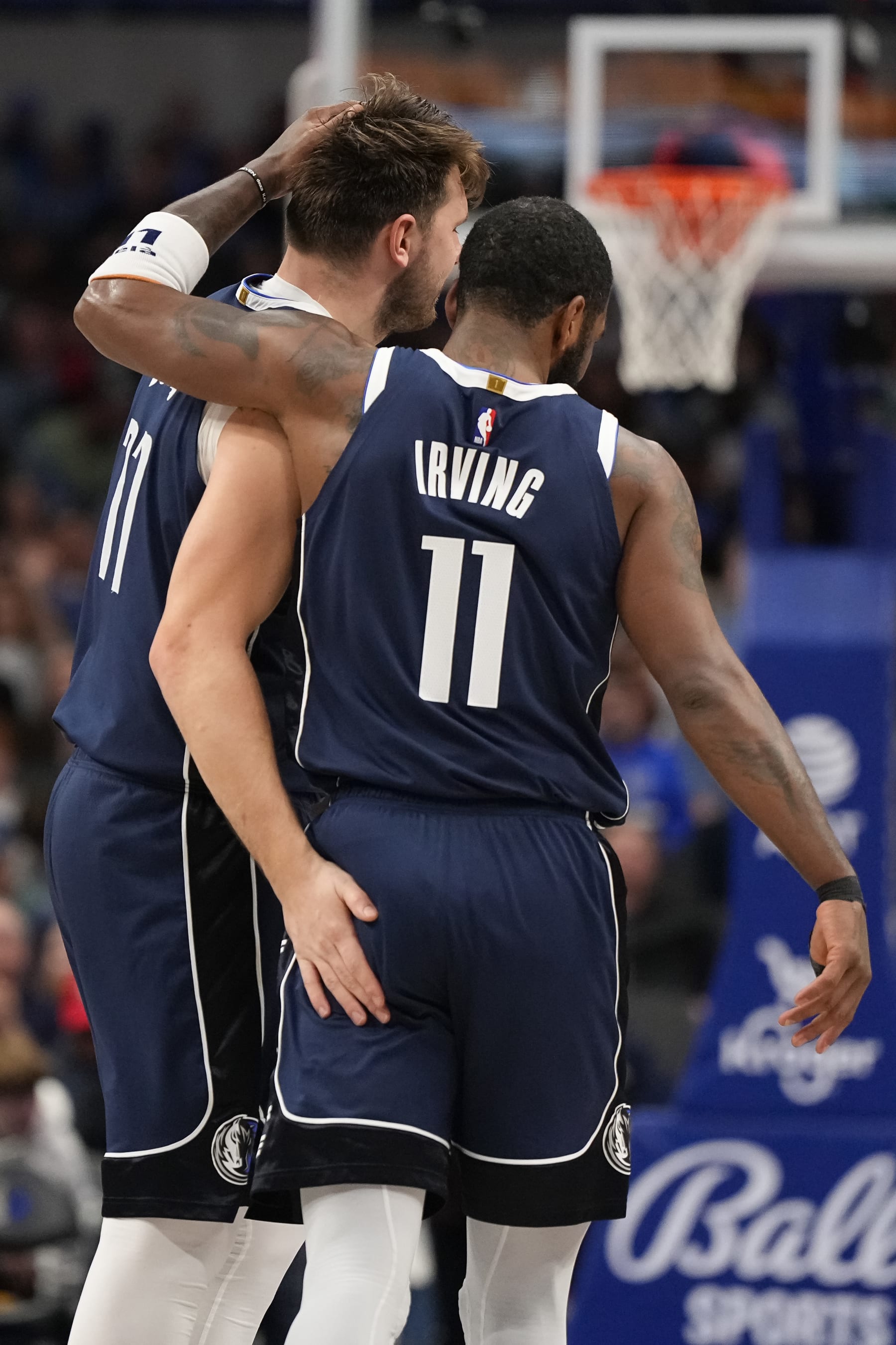 DALLAS, TEXAS - FEBRUARY 10: Luka Doncic #77 and Kyrie Irving #11 of the Dallas Mavericks embrace during the second half against the Oklahoma City Thunder at American Airlines Center on February 10, 2024 in Dallas, Texas. NOTE TO USER: User expressly acknowledges and agrees that, by downloading and or using this photograph, User is consenting to the terms and conditions of the Getty Images License Agreement. (Photo by Sam Hodde/Getty Images)