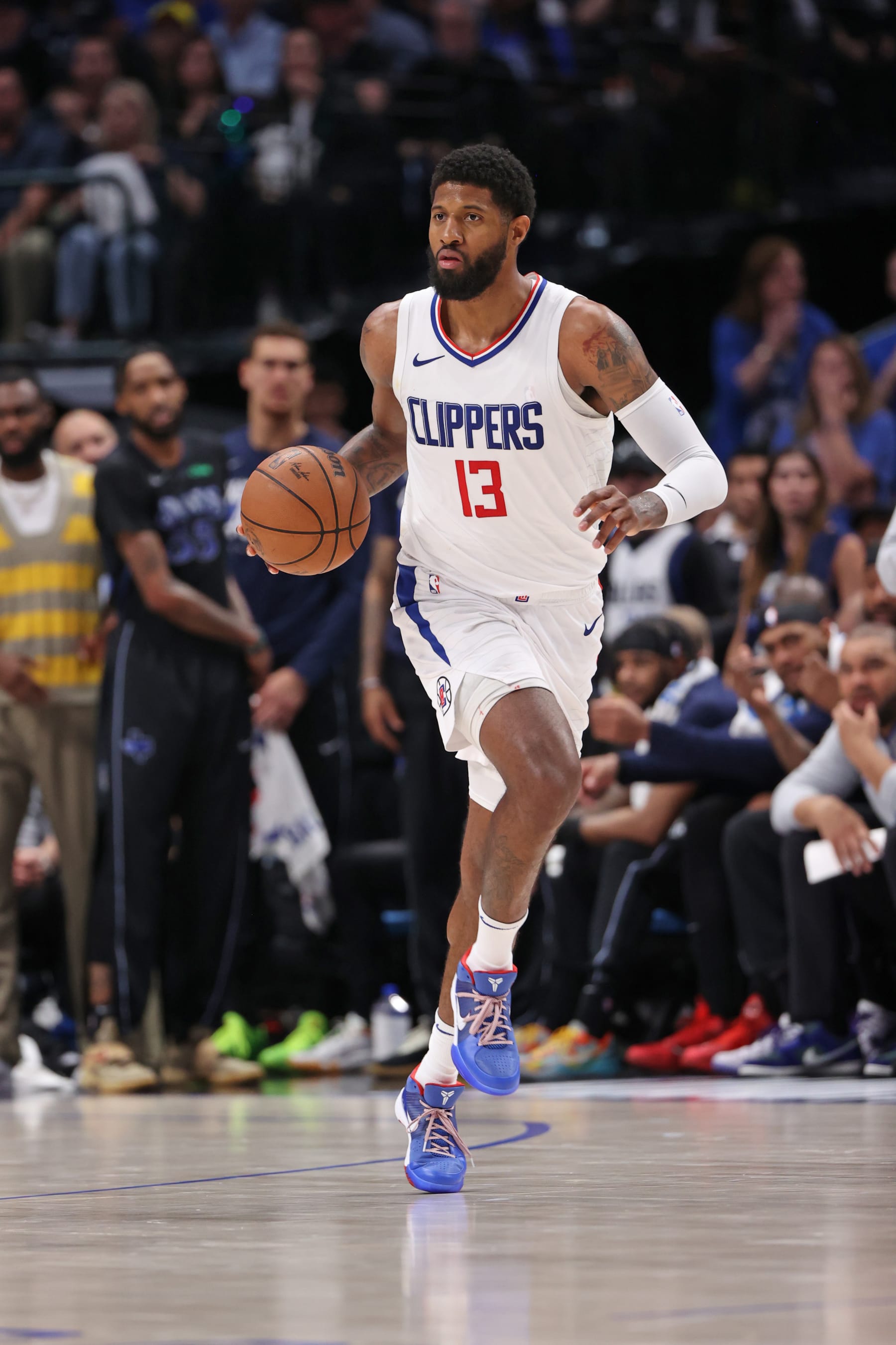 DALLAS, TX - MAY 3: Paul George #13 of the LA Clippers dribbles the ball during the game against the Dallas Mavericks during Round 1 Game 6 of the 2024 NBA Playoffs on May 3, 2024 at the American Airlines Center in Dallas, Texas. NOTE TO USER: User expressly acknowledges and agrees that, by downloading and or using this photograph, User is consenting to the terms and conditions of the Getty Images License Agreement. Mandatory Copyright Notice: Copyright 2024 NBAE (Photo by Joe Murphy/NBAE via Getty Images)