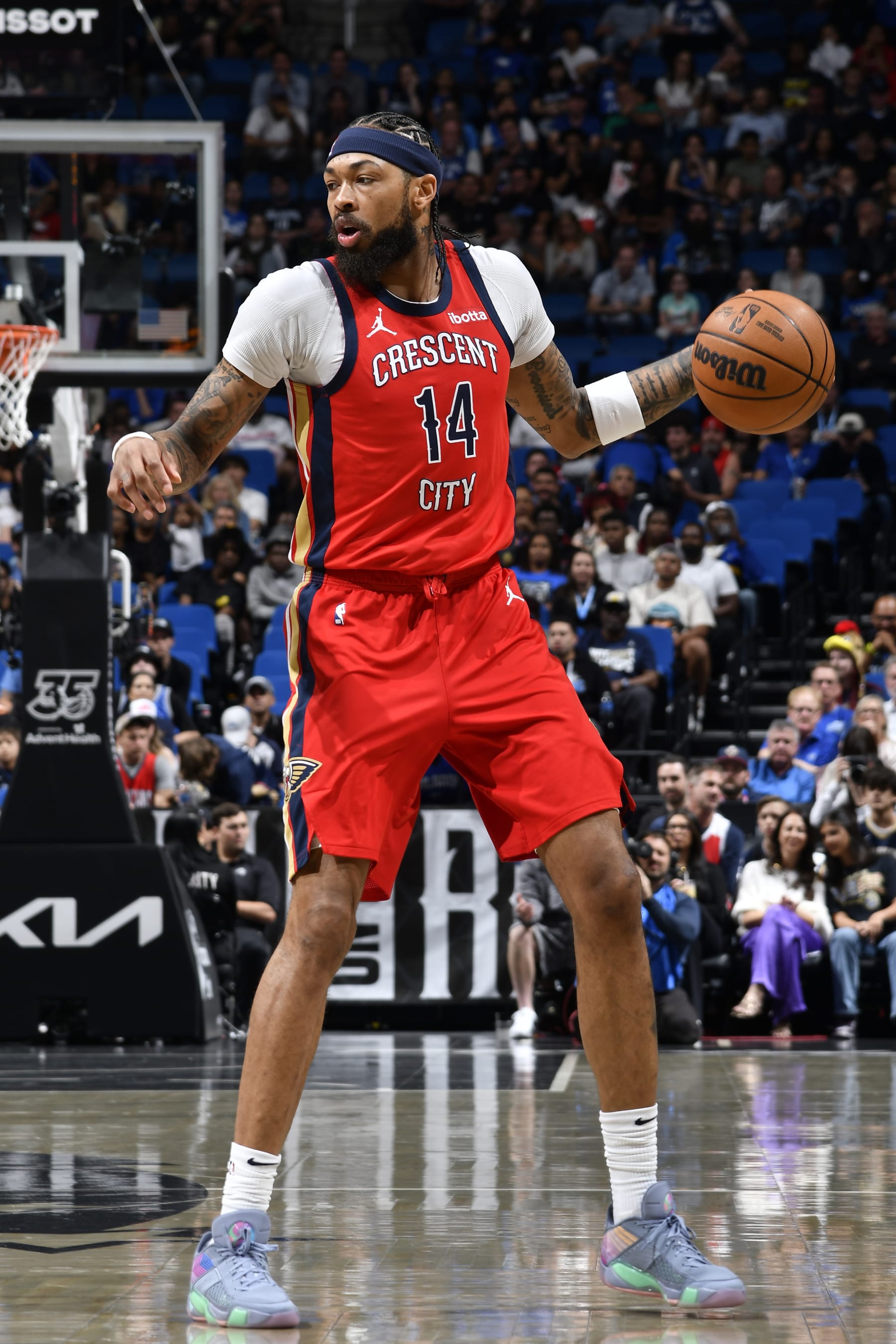 ORLANDO, FL - MARCH 21: Brandon Ingram #14 of the New Orleans Pelicans dribbles the ball during the game against the Orlando Magic on March 21, 2024 at Amway Center in Orlando, Florida. NOTE TO USER: User expressly acknowledges and agrees that, by downloading and or using this photograph, User is consenting to the terms and conditions of the Getty Images License Agreement. Mandatory Copyright Notice: Copyright 2024 NBAE (Photo by Fernando Medina/NBAE via Getty Images)