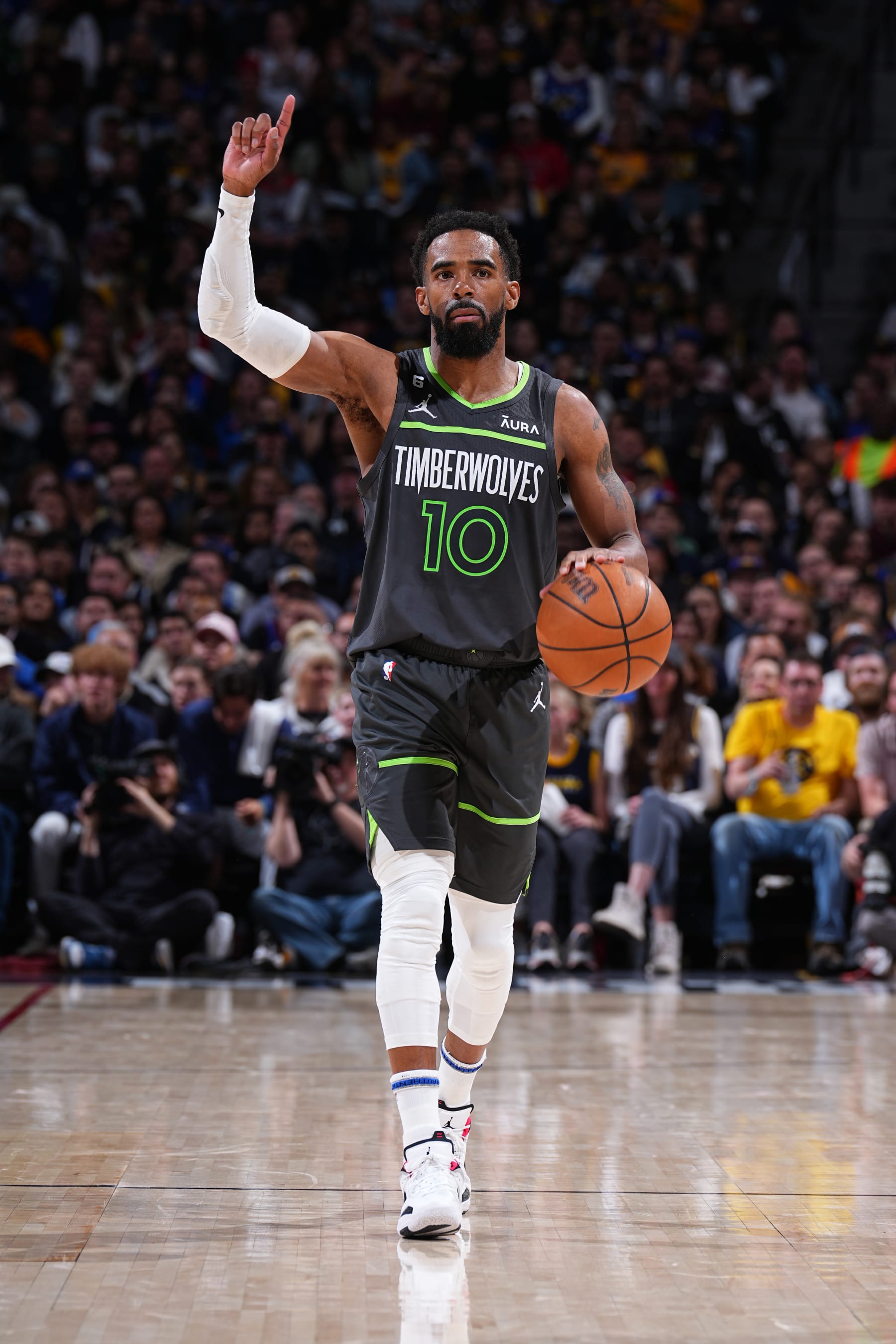 DENVER, CO - APRIL 25: Mike Conley #10 of the Minnesota Timberwolves dribbles the ball during Round One Game Five of the 2023 NBA Playoffs against the Denver Nuggets on April 25, 2023 at the Ball Arena in Denver, Colorado. NOTE TO USER: User expressly acknowledges and agrees that, by downloading and/or using this Photograph, user is consenting to the terms and conditions of the Getty Images License Agreement. Mandatory Copyright Notice: Copyright 2023 NBAE (Photo by Garrett Ellwood/NBAE via Getty Images)