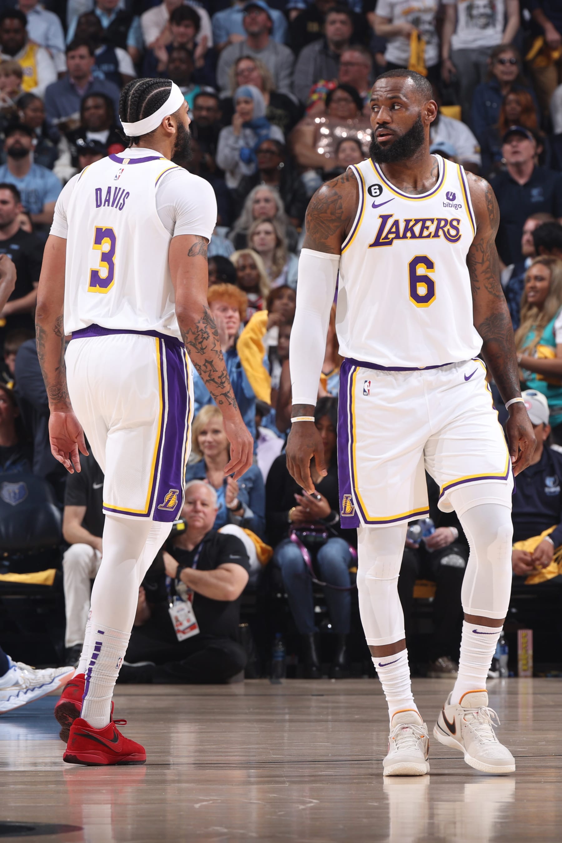 MEMPHIS, TN - APRIL 16: Anthony Davis #3 and LeBron James #6 of the Los Angeles Lakers stand on the court against the Memphis Grizzlies during Round 1 Game 1 of the NBA Playoffs on April 16, 2023 at FedExForum in Memphis, Tennessee. NOTE TO USER: User expressly acknowledges and agrees that, by downloading and or using this photograph, User is consenting to the terms and conditions of the Getty Images License Agreement. Mandatory Copyright Notice: Copyright 2023 NBAE (Photo by Joe Murphy/NBAE via Getty Images)