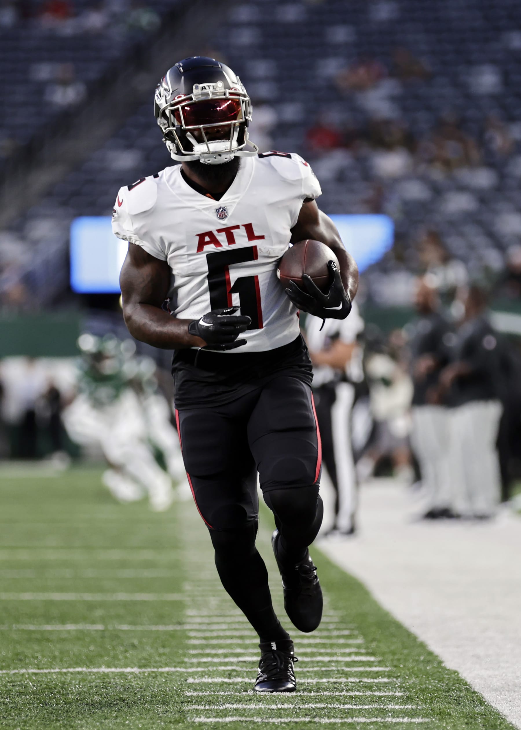 Atlanta Falcons running back Damien Williams (6) warms up before a preseason NFL football game against the New York Jets Monday, Aug. 22, 2022, in East Rutherford, N.J. (AP Photo/Adam Hunger)