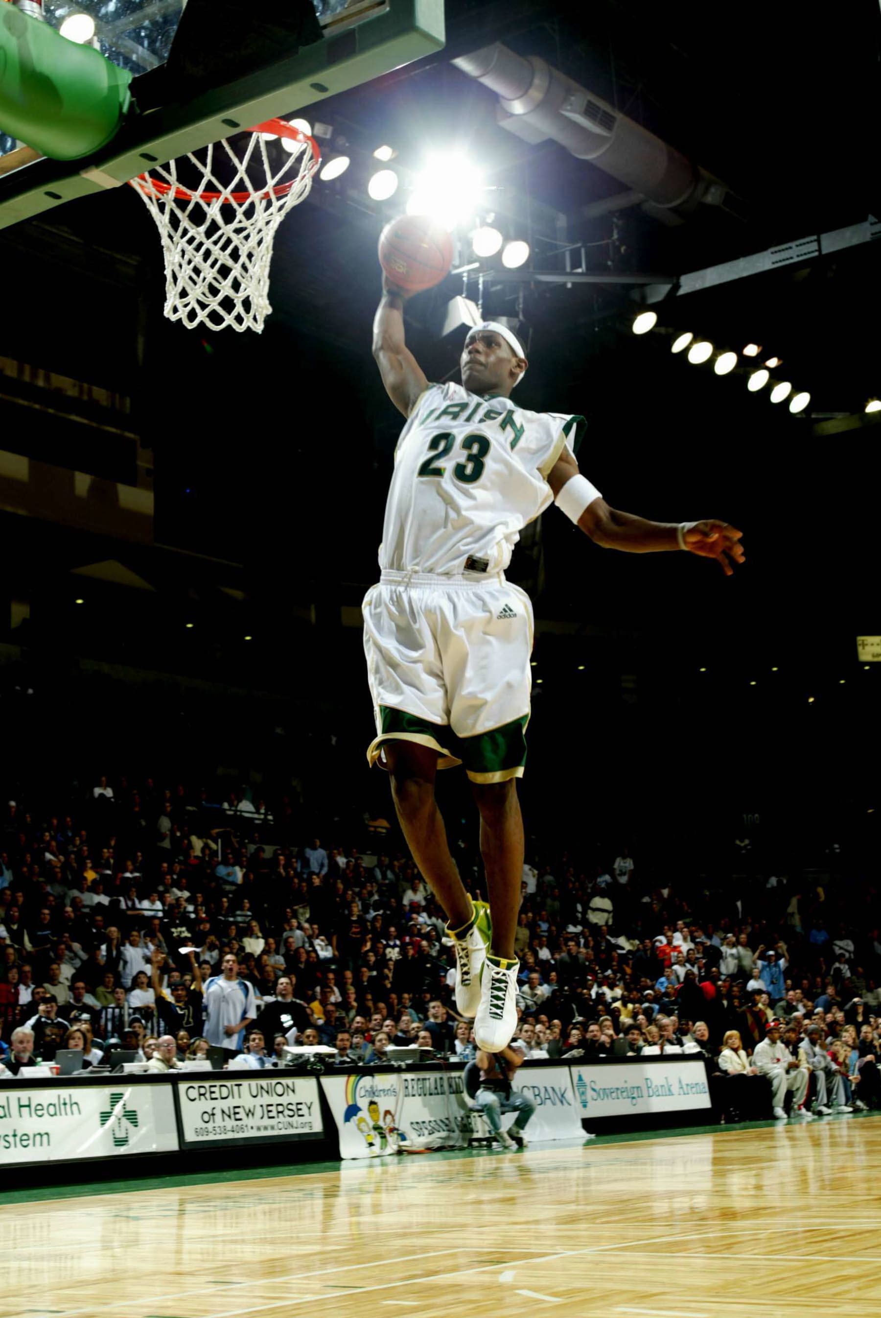 TRENTON, NJ - FEBRUARY 8:  LeBron James #23 of the St. Vincent-St. Mary Fighting Irish goes up for a slam dunk during the game against the Los Angeles Westchester Comets in the Primetime Shootout at Sovereign Bank Arena on February 8, 2003 in Trenton, New Jersey.  The Irish won 78-52.  NOTE TO USER: User expressly acknowledges and agrees that, by downloading and/or using this Photograph, User is consenting to the terms and conditions of the Getty Images License Agreement  Copyright 2003 NBAE  (Photo by Dave Saffran/NBAE via Getty Images)
