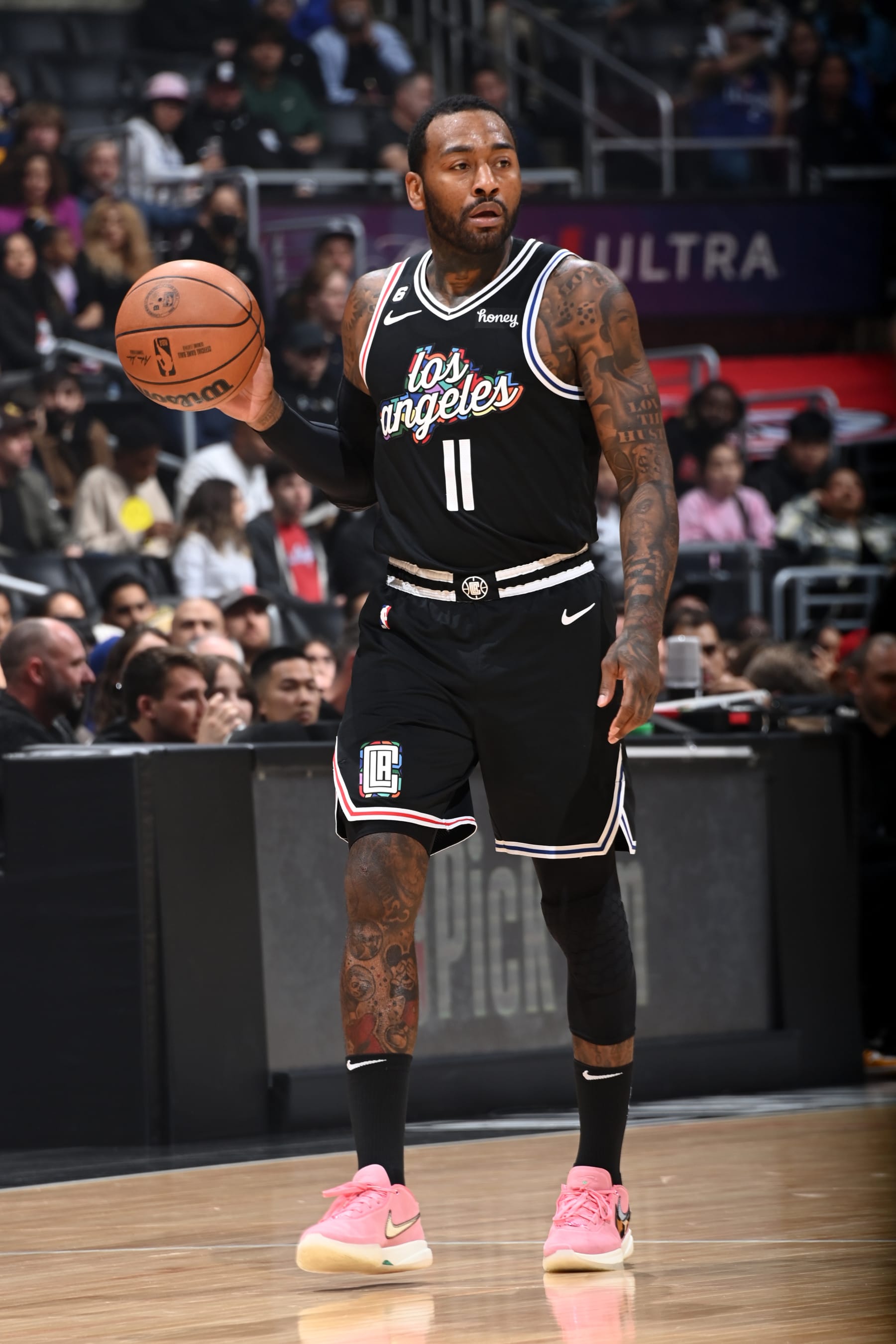 LOS ANGELES, CA - JANUARY 13: John Wall #11 of the LA Clippers dribbles the ball during the game against the Denver Nuggets on January 13, 2023 at Crypto.Com Arena in Los Angeles, California. NOTE TO USER: User expressly acknowledges and agrees that, by downloading and/or using this Photograph, user is consenting to the terms and conditions of the Getty Images License Agreement. Mandatory Copyright Notice: Copyright 2023 NBAE (Photo by Andrew D. Bernstein/NBAE via Getty Images)