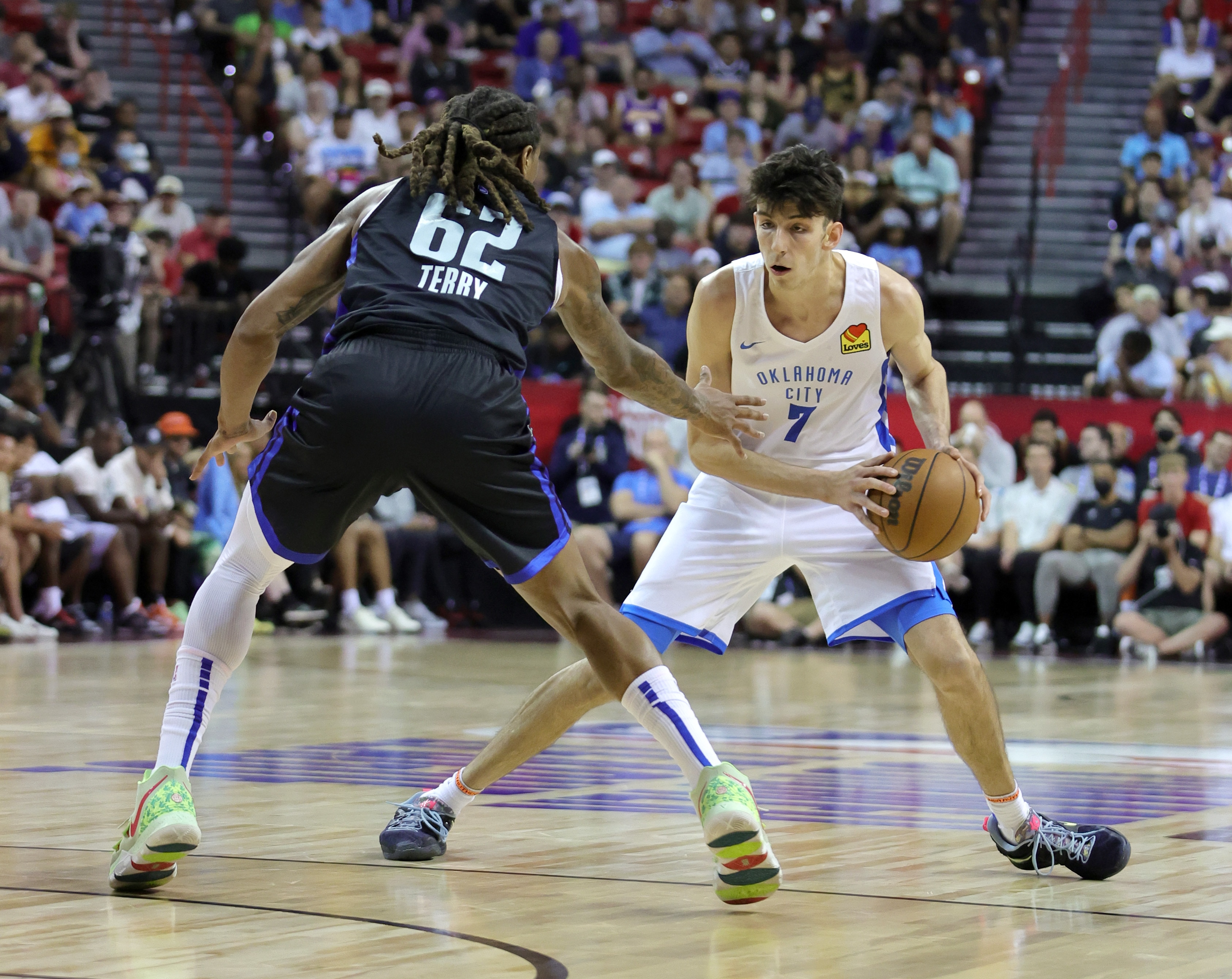 LAS VEGAS, NEVADA - JULY 11: Chet Holmgren #7 of the Oklahoma City Thunder is guarded by Emanuel Terry #62 of the Orlando Magic during the 2022 NBA Summer League at the Thomas & Mack Center on July 11, 2022 in Las Vegas, Nevada. NOTE TO USER: User expressly acknowledges and agrees that, by downloading and or using this photograph, User is consenting to the terms and conditions of the Getty Images License Agreement. (Photo by Ethan Miller/Getty Images)