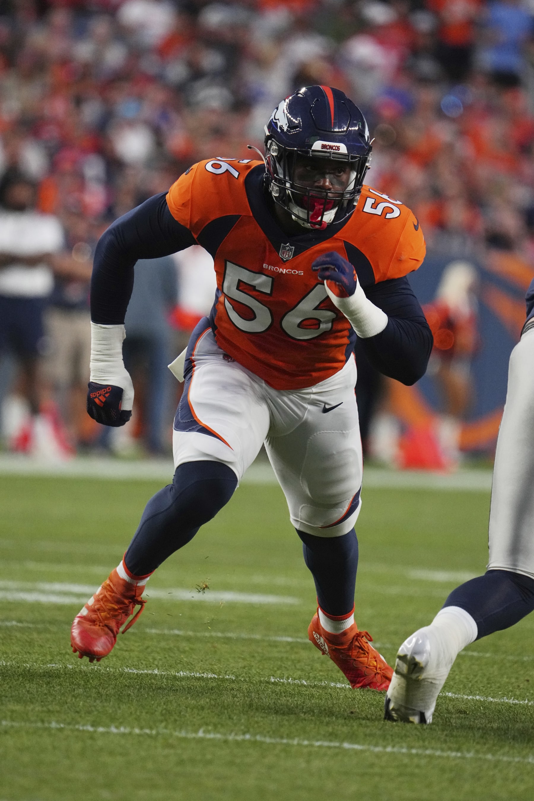 Denver Broncos linebacker Baron Browning (56) runs a play against the Dallas Cowboys in the first half of an NFL football game Saturday, Aug 13, 2022, in Denver. (AP Photo/Bart Young)