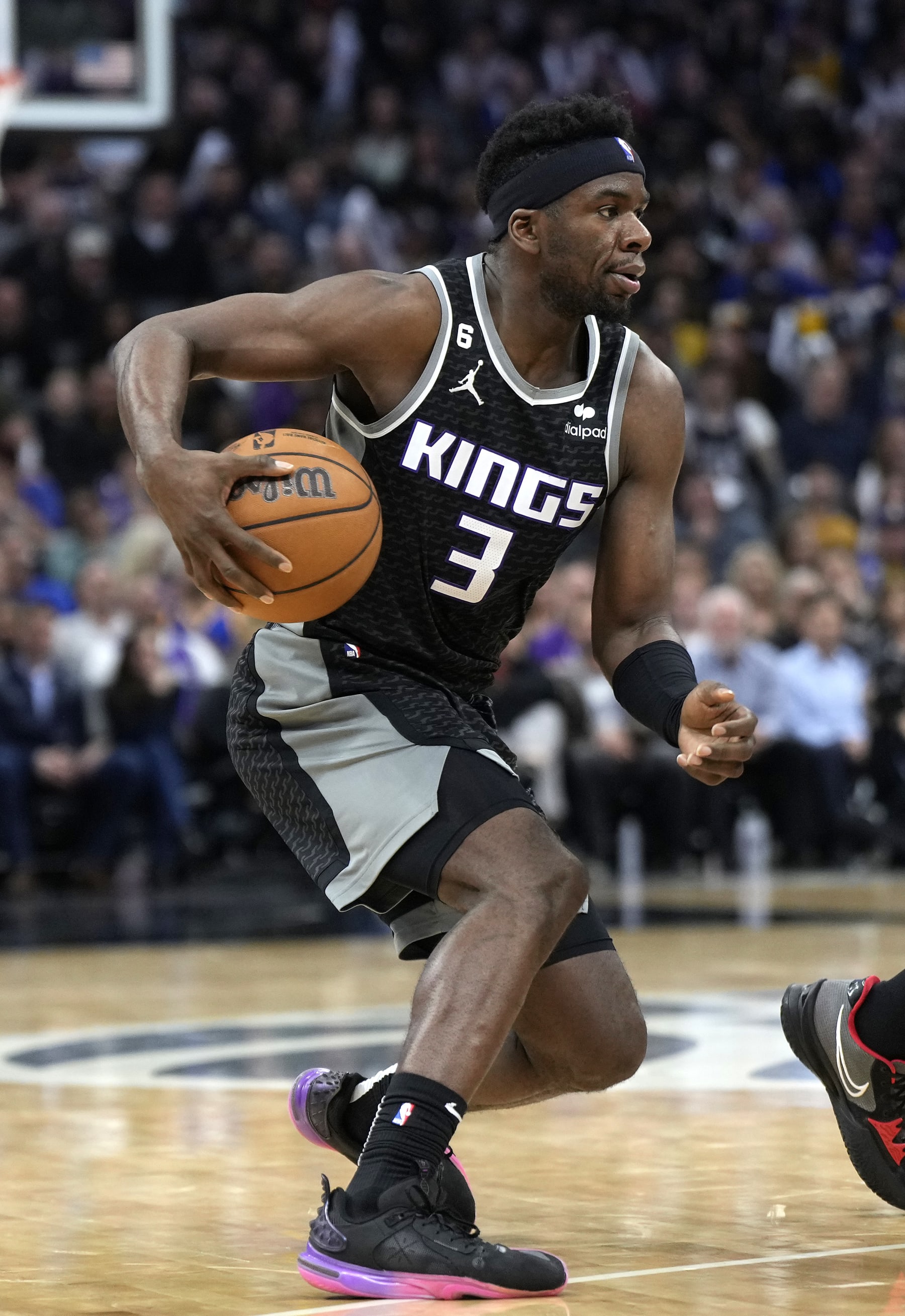 SACRAMENTO, CALIFORNIA - APRIL 07: Terence Davis #3 of the Sacramento Kings dribbles the ball against the Golden State Warriors during the fourth quarter of an NBA basketball game at Golden 1 Center on April 07, 2023 in Sacramento, California.NOTE TO USER: User expressly acknowledges and agrees that, by downloading and or using this photograph, User is consenting to the terms and conditions of the Getty Images License Agreement. (Photo by Thearon W. Henderson/Getty Images)