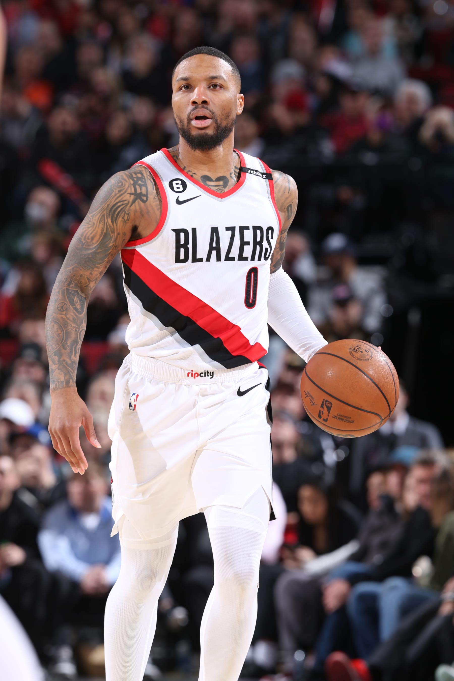 PORTLAND, OR - MARCH 14:  Damian Lillard #0 of the Portland Trail Blazers goes to the basket during the game on March 14, 2023 at the Moda Center Arena in Portland, Oregon. NOTE TO USER: User expressly acknowledges and agrees that, by downloading and or using this photograph, user is consenting to the terms and conditions of the Getty Images License Agreement. Mandatory Copyright Notice: Copyright 2023 NBAE (Photo by Sam Forencich/NBAE via Getty Images)