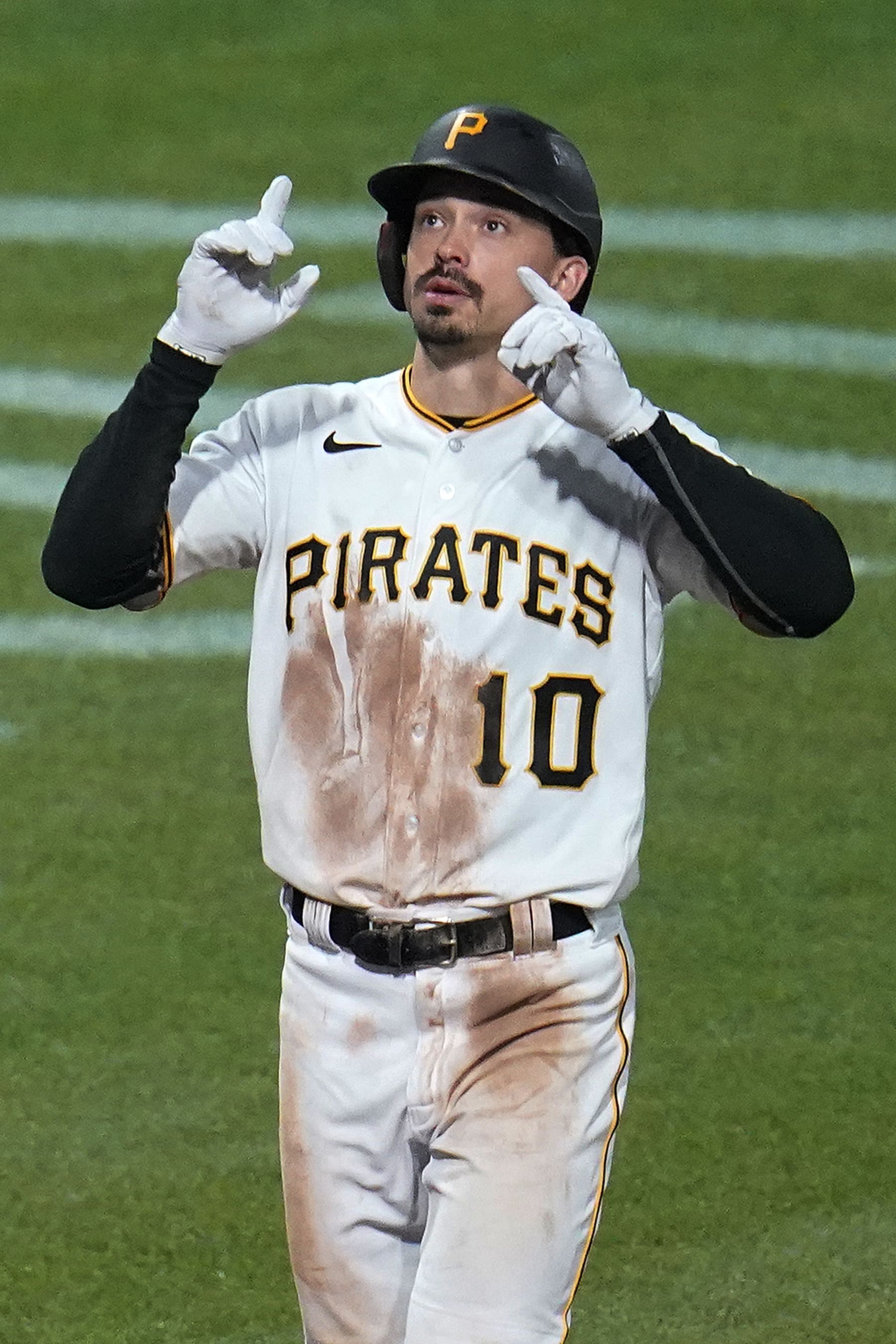 Pittsburgh Pirates' Bryan Reynolds crosses home plate after hitting a solo home run off Chicago Cubs relief pitcher Manuel Rodriguez during the seventh inning of a baseball game in Pittsburgh, Friday, Sept. 23, 2022. The Cubs won 6-5. (AP Photo/Gene J. Puskar)
