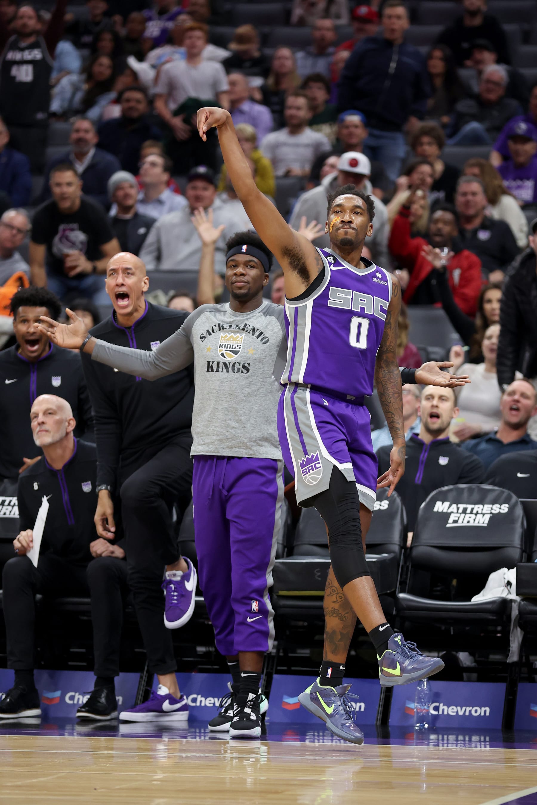 SACRAMENTO, CALIFORNIA - NOVEMBER 09: Malik Monk #0 of the Sacramento Kings watches a three-point basket go in against the Cleveland Cavaliers in the first half at Golden 1 Center on November 09, 2022 in Sacramento, California. NOTE TO USER: User expressly acknowledges and agrees that, by downloading and or using this photograph, User is consenting to the terms and conditions of the Getty Images License Agreement.  (Photo by Ezra Shaw/Getty Images)