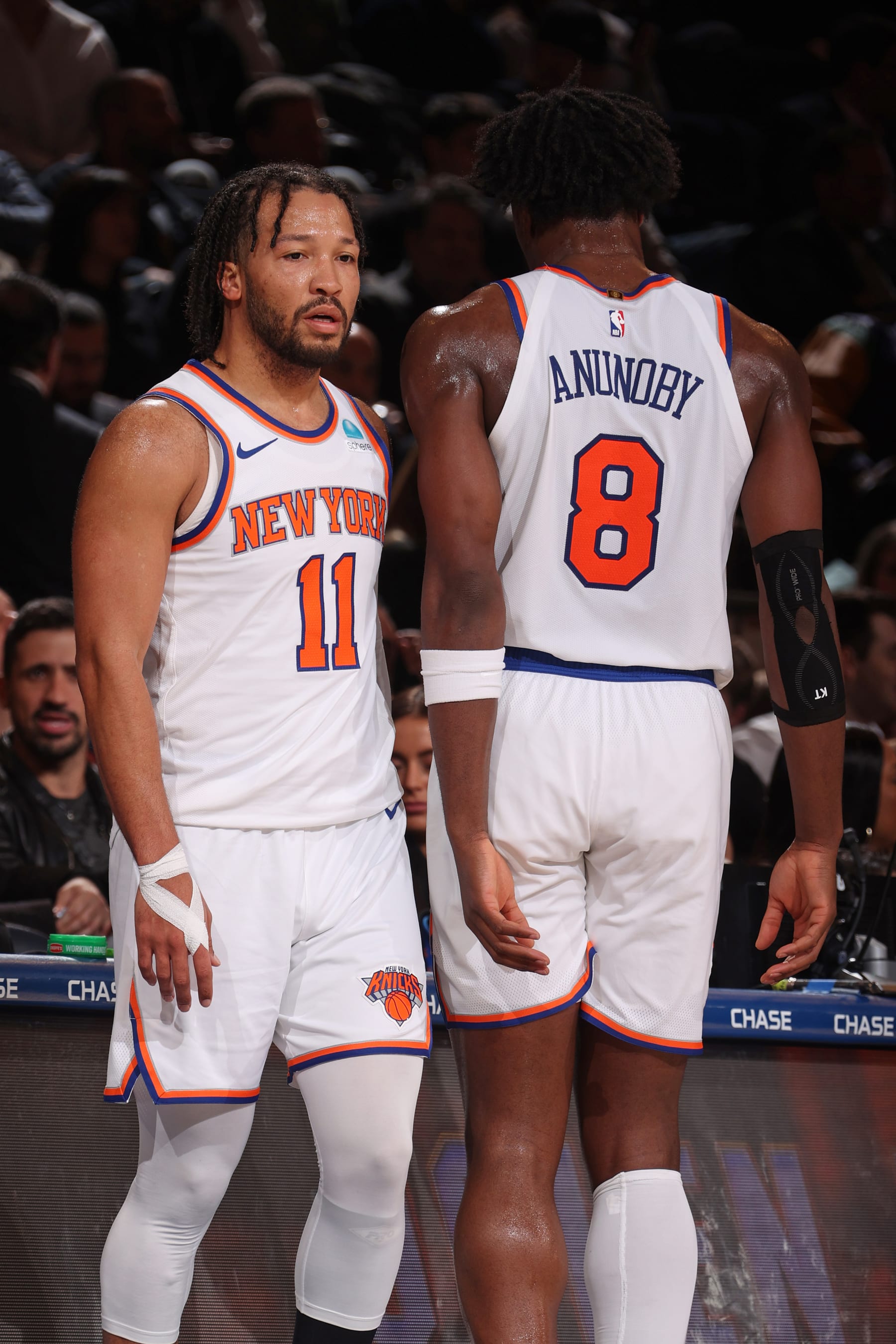 NEW YORK, NY - JANUARY 18: Jalen Brunson #11 and OG Anunoby #8 of the New York Knicks stand on the court against the Washington Wizards on January 18, 2024 at Madison Square Garden in New York City, New York. NOTE TO USER: User expressly acknowledges and agrees that, by downloading and or using this photograph, User is consenting to the terms and conditions of the Getty Images License Agreement. Mandatory Copyright Notice: Copyright 2024 NBAE  (Photo by Nathaniel S. Butler/NBAE via Getty Images)