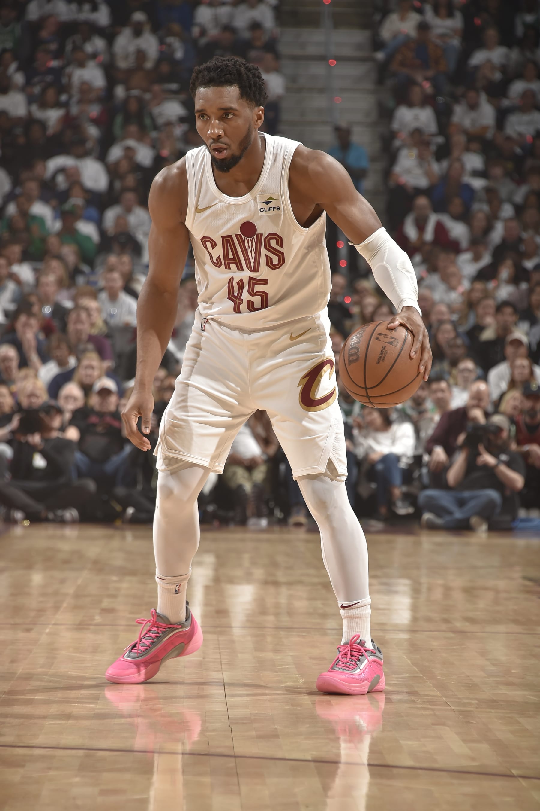CLEVELAND, OH - MAY 11: Donovan Mitchell #45 of the Cleveland Cavaliers dribbles the ball during the game against the Boston Celtics during Round 2 Game 3 of the 2024 NBA Playoffs on May 11, 2024 at Rocket Mortgage FieldHouse in Cleveland, Ohio. NOTE TO USER: User expressly acknowledges and agrees that, by downloading and/or using this Photograph, user is consenting to the terms and conditions of the Getty Images License Agreement. Mandatory Copyright Notice: Copyright 2024 NBAE (Photo by David Liam Kyle/NBAE via Getty Images)
