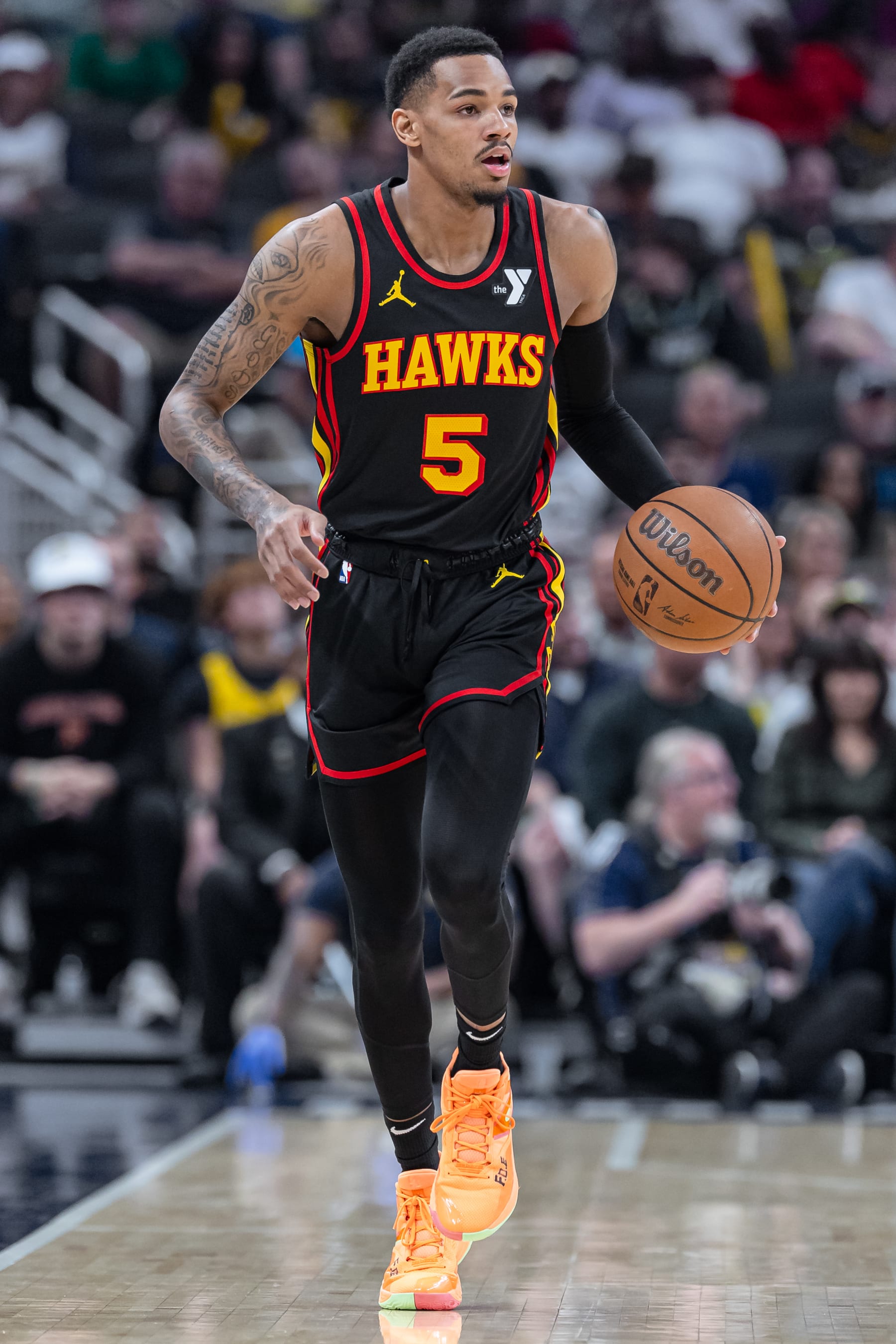 INDIANAPOLIS, INDIANA - APRIL 14: Dejounte Murray #5 of the Atlanta Hawks brings the ball up court during the game against the Indiana Pacers at Gainbridge Fieldhouse on April 14, 2024 in Indianapolis, Indiana. NOTE TO USER: User expressly acknowledges and agrees that, by downloading and or using this photograph, User is consenting to the terms and conditions of the Getty Images License Agreement. (Photo by Michael Hickey/Getty Images)